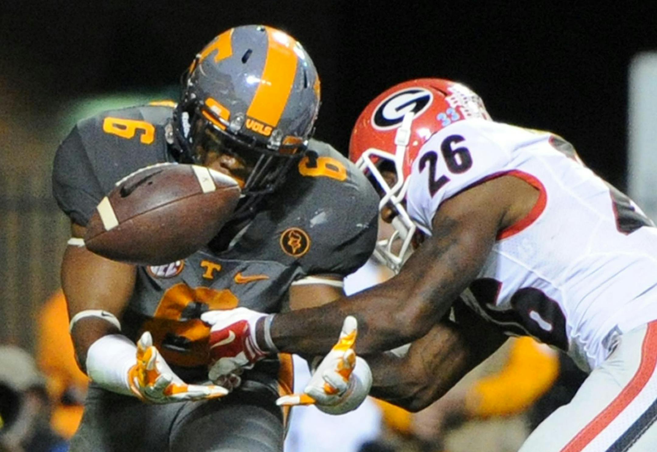 Tennessee defensive back Todd Kelly Jr. (6) breaks up a pass intended for Georgia split end Malcolm Mitchell (26) during the second half of an NCAA college football game, in Knoxville, Tenn., on Saturday, Oct. 10, 2015. Tennessee won 38-31. (Adam Lau/Knoxville News Sentinel via AP) MANDATORY CREDIT