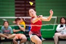 St. Paul Highland Park’s Phlower Vang returns the birdie to Kimberly Tobar of St. Paul Harding during their badminton high school state championship