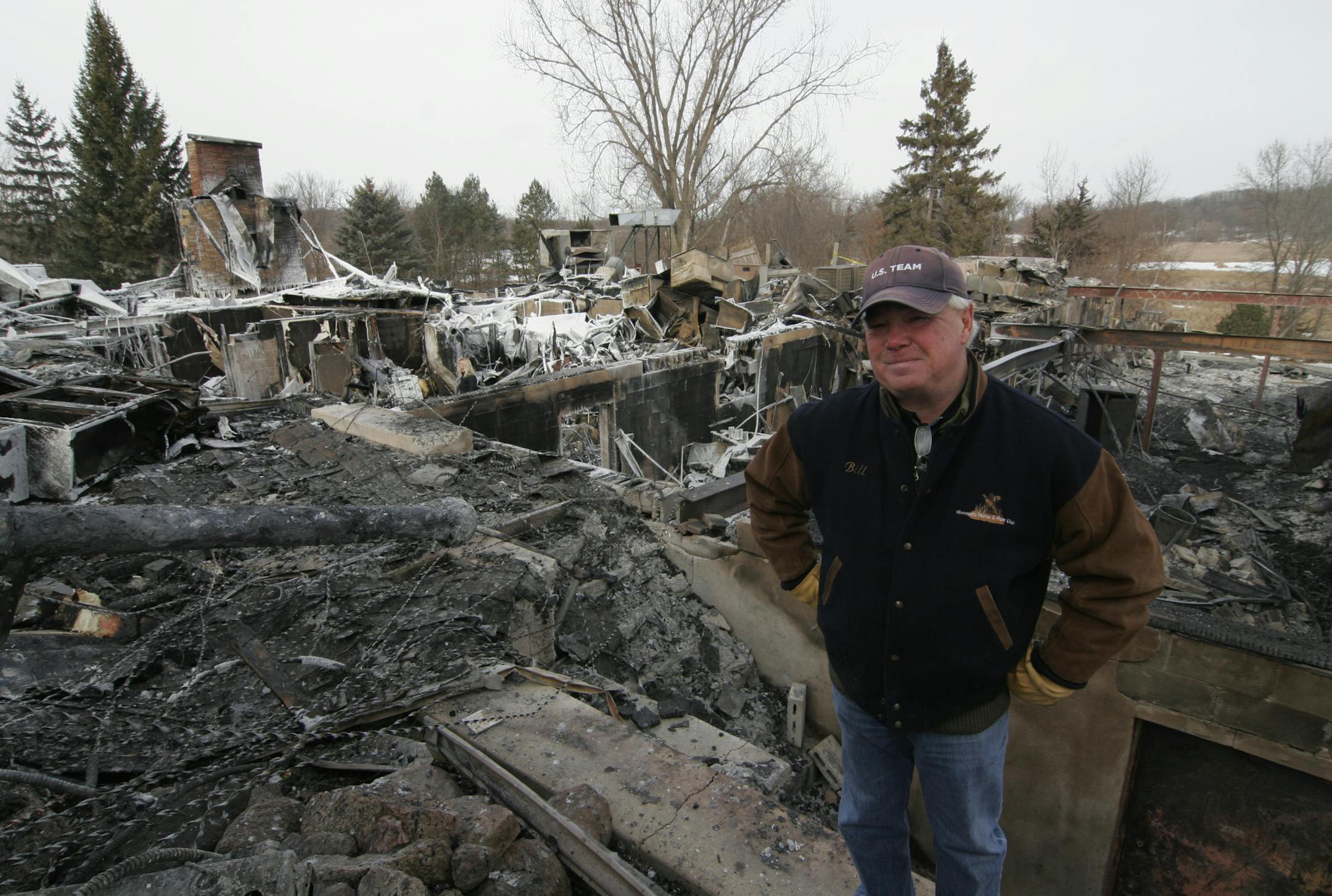Doug Smith/Star Tribune; Jan. 3, 2014. Bill Urseth, co-owner of the Minnesota Horse and Hunt Club, stands in the ruins of his clubhouse-restaurant, which was destroyed by fire last week. The shooting and hunting business is open, using another building, and Urseth says he will rebuild.