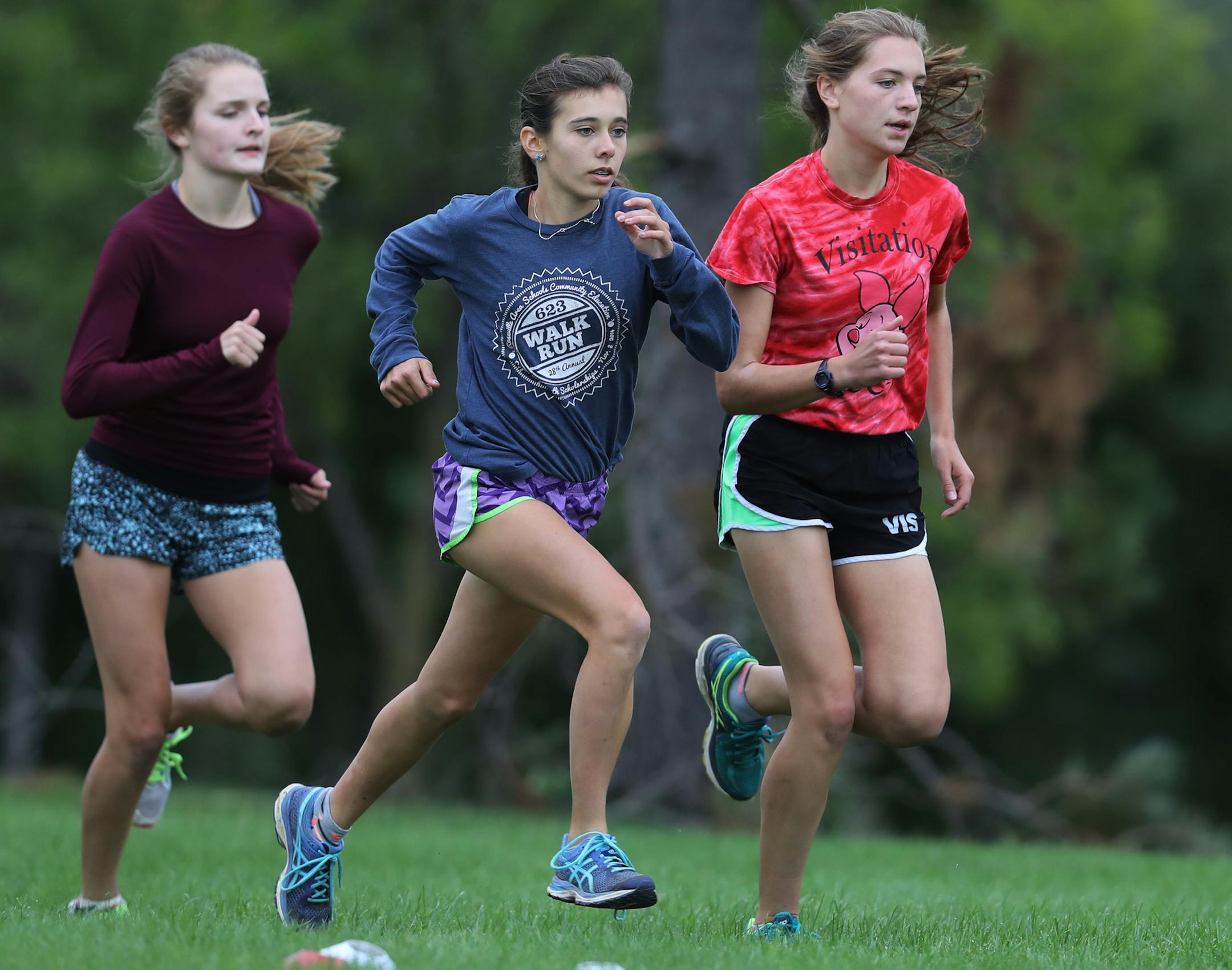Left to right: Lauren Kern, Margaret Dalseth, and Mary Kate Schoonover did their interval training.] The girls' cross country team at Visitation is making waves this season.Richard Tsong-Taatarii/rtsong-taatarii@startribune.com