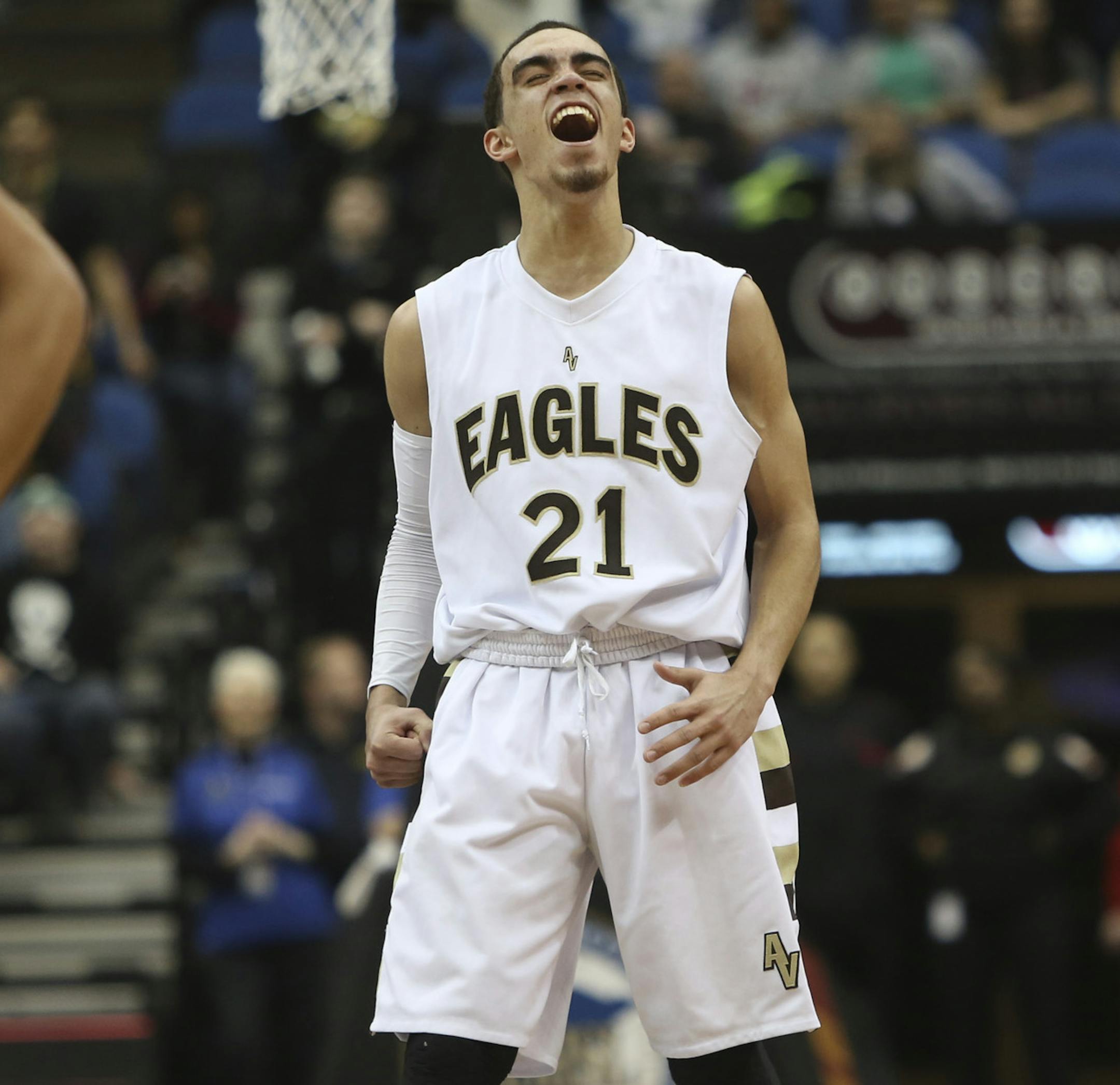Apple Valley's Tyus Jones celebrated as he was taken out of the game in the class 4A championship at the Target Center in Minneapolis, Min., Saturday, March 23, 2013. Apple Valley won 74-57 over Park Center. ] (KYNDELL HARKNESS/STAR TRIBUNE) kyndell.harkness@startribune.com ORG XMIT: MIN1303232251420002