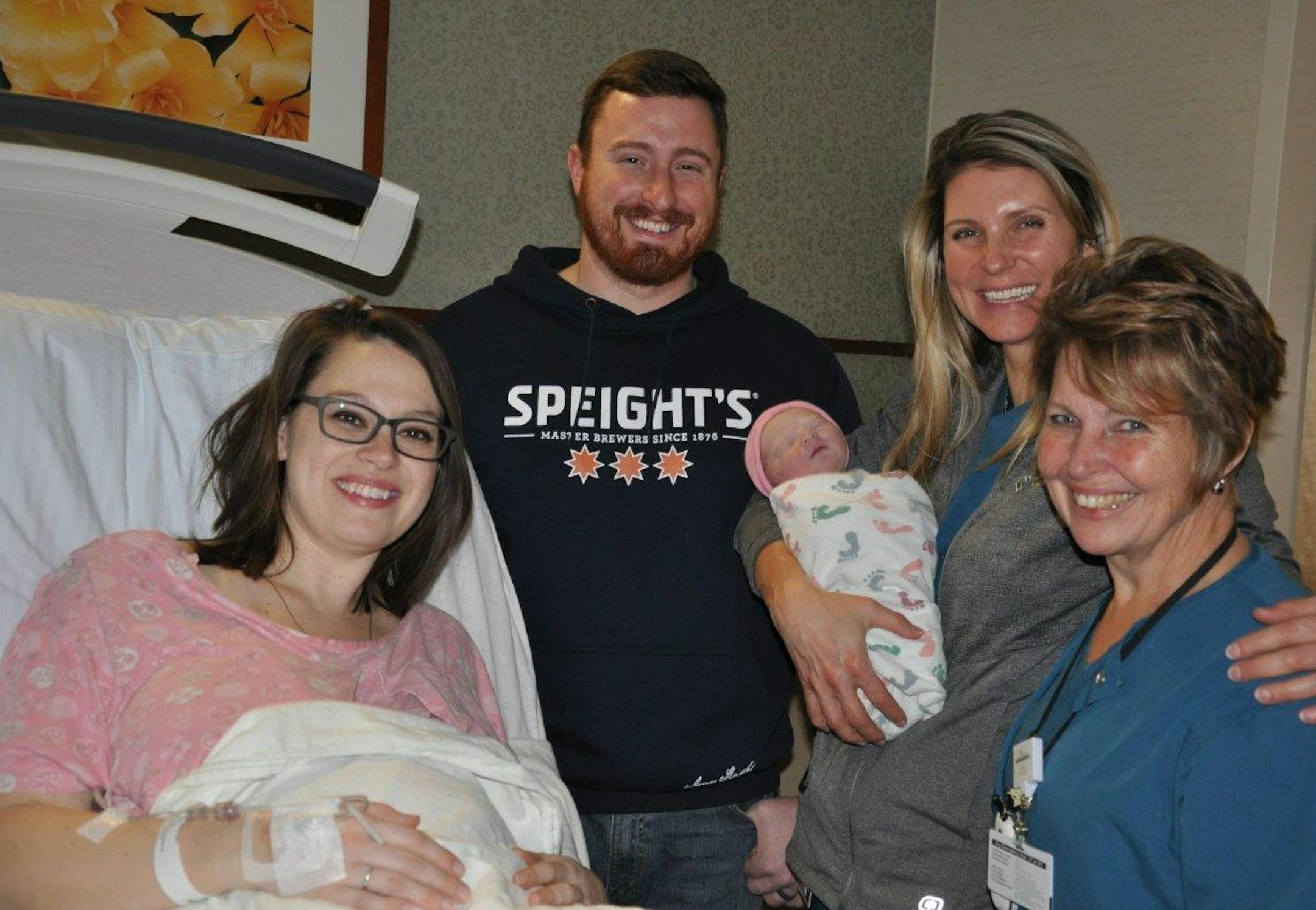 Justine and Pat Charmoli of Big Lake, Minn., with their daughter Clare Ruth, believed to be the first baby born in the Twin Cities in 2019. Clare arrived 8 minutes after midnight at Maple Grove Hospital. On the right are Dr. Kristin Lyerly of Park Nicollet Women's Health and nurse Sandy Anderson.