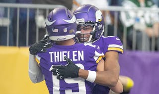 Minnesota Vikings wide receiver Adam Thielen (19) celebrates with Minnesota Vikings wide receiver Justin Jefferson (18) after he made a touchdown in t
