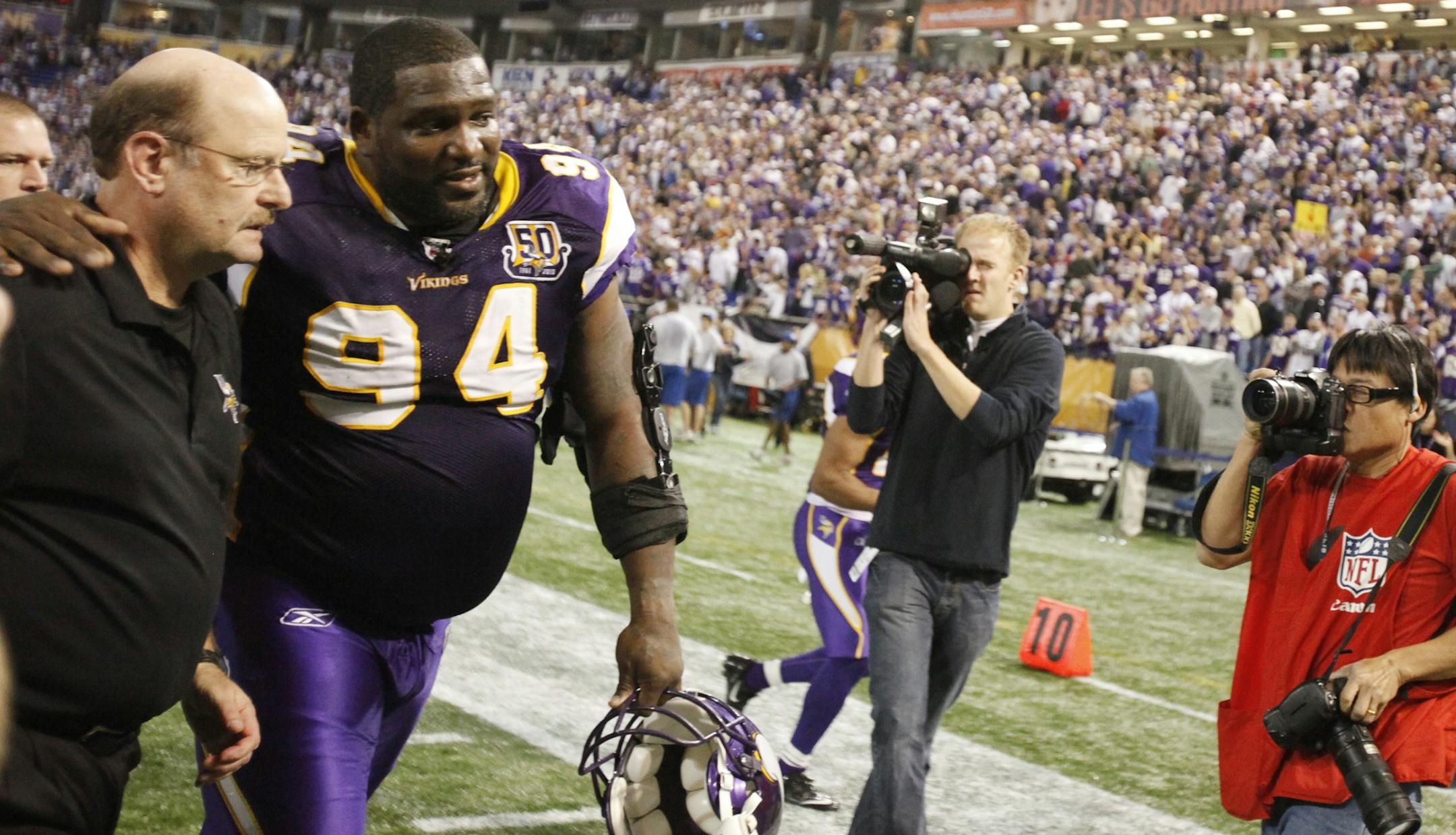 Vikings coach Brad Childress and lineman Pat Williams walked of the field after Minnesota beat Arizona 27-24 Sunday at the dome.