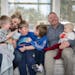 The act of taking a family photo can be lots of work for Kate Swenson and her husband who are raising four kids, their oldest Cooper with non-verbal a
