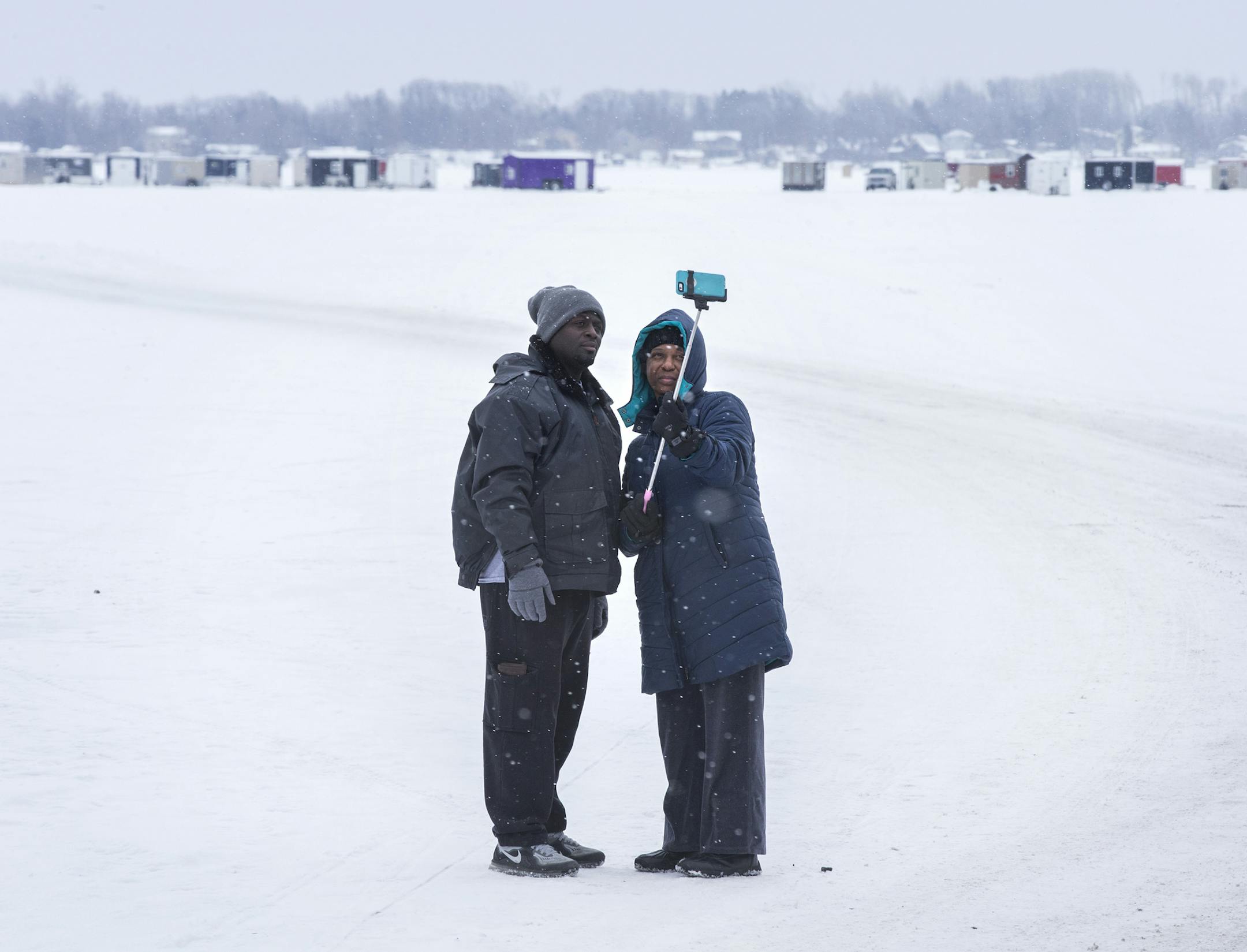 Lakesha Bulloch and her husband Eldridge Bulloch pose for a selfie on North Long Lake in the Brainerd Lakes area on Thursday, January 21, 2016. Bulloch, a traveling phlebotomist from Mississippi, is staying the area for a week and she and her husband have never stood on a frozen lake before. ] (Leila Navidi/Star Tribune) leila.navidi@startribune.com