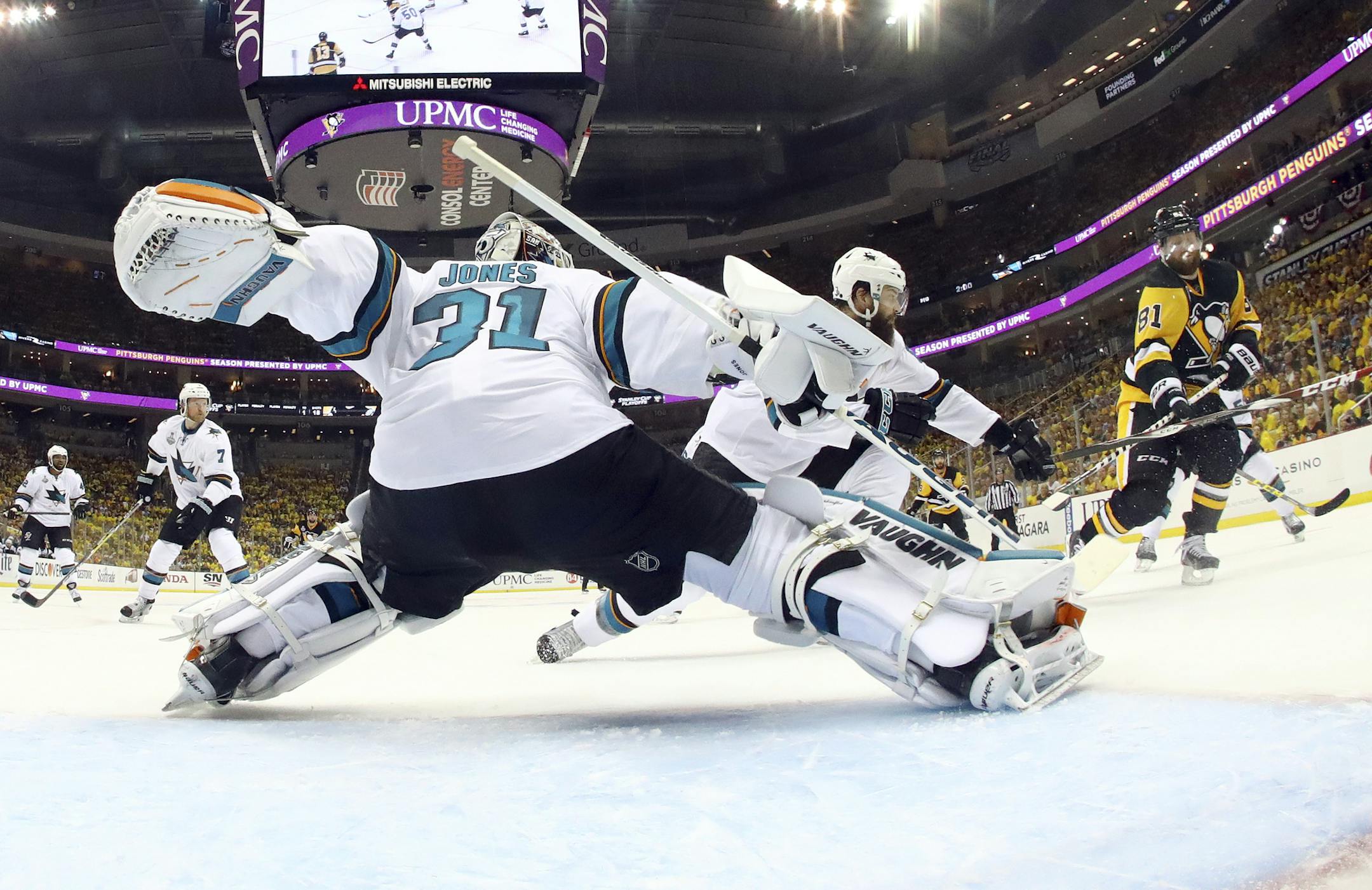 San Jose Sharks goalie Martin Jones (31) defends against Pittsburgh Penguins' Phil Kessel (81) during the second period in Game 1 of the Stanley Cup final series Monday, May 30, 2016, in Pittsburgh. (AP Photo/Bruce Bennett)