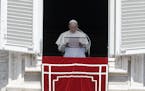 FILE - In this Sunday, Aug. 19, 2018 file photo, Pope Francis prays for the victims of the Kerala floods during the Angelus noon prayer in St.Peter's 