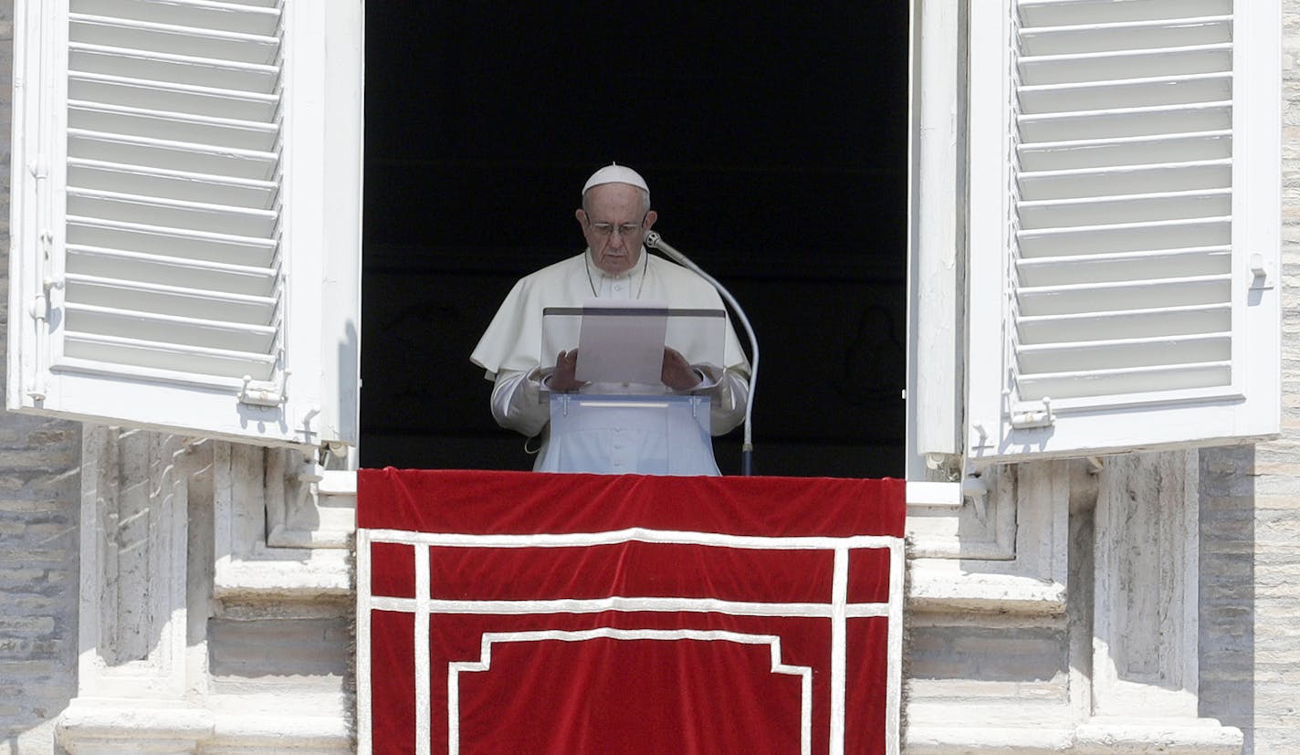 FILE - In this Sunday, Aug. 19, 2018 file photo, Pope Francis prays for the victims of the Kerala floods during the Angelus noon prayer in St.Peter's Square, at the Vatican. Pope Francis has issued a letter to Catholics around the world condemning the "crime" of priestly sexual abuse and cover-up and demanding accountability, in response to new revelations in the United States of decades of misconduct by the Catholic Church. (AP Photo/Gregorio Borgia, File)