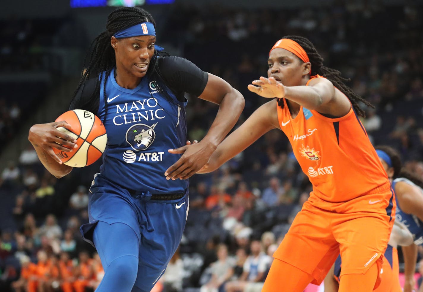 The Minnesota Lynx's Sylvia Fowles (34) drives on the Connecticut Sun's Jonquel Jones last August.