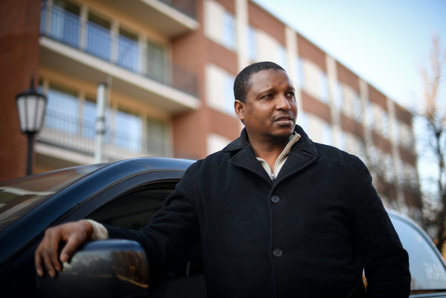 Papa Faal was photographed outside his cab Tuesday afternoon between fares in downtown Minneapolis. ] (AARON LAVINSKY/STAR TRIBUNE) aaron.lavinsky@startribune.com Almost two years ago, Papa Faal ,a quiet family man, Army vet and IT instructor from Brooklyn Park, traveled to Gambia and took part in armed plot to overthrow the West African nation's ruler of more than two decades. After the coup failed, the U.S. government convicted Faal of taking up arms against a friendly country but gave him a l