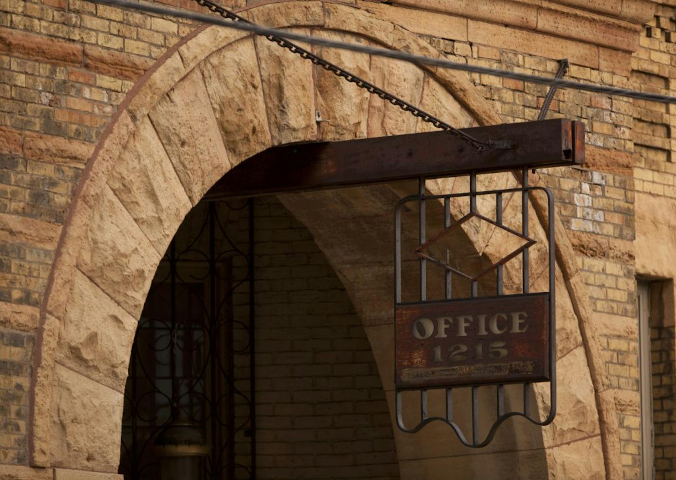 The sign above the entrance to the former Grain Belt offices. Despite the building's 19th-century charm, it has problems with a leaky basement.