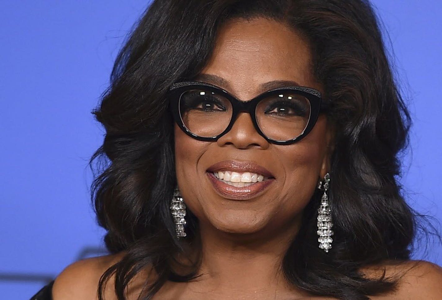 In this Jan. 7, 2018, file photo, Oprah Winfrey poses in the press room with the Cecil B. DeMille Award at the 75th annual Golden Globe Awards in Beverly Hills, Calif.