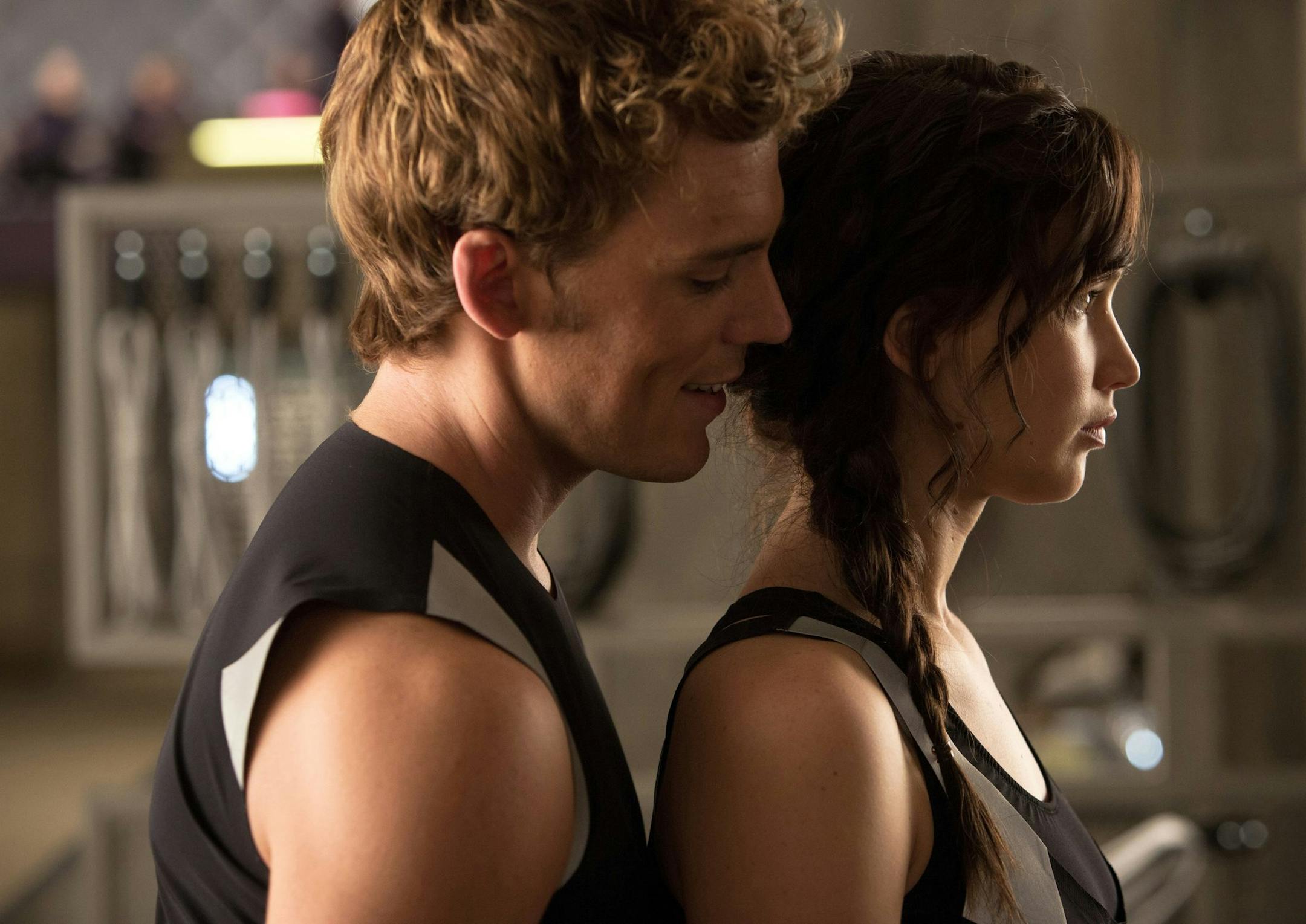 Finnick Odair (Sam Claflin, left) and Katniss Everdeen (Jennifer Lawrence) in "The Hunger Games: Catching Fire." (Courtesy Murray Close/MCT) ORG XMIT: 1145570