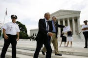 Dick Heller walks to a news conference outside the Supreme Court in Washington, Thursday, June 26, 2008. Americans can keep guns at home for self-defe