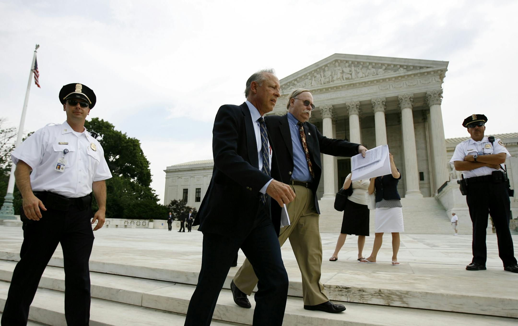 Dick Heller walks to a news conference outside the Supreme Court in Washington, Thursday, June 26, 2008. Americans can keep guns at home for self-defense, the court ruled Thursday in the justices' first-ever pronouncement on the meaning of gun rights under the Second Amendment. (AP Photo/Jose Luis Magana)