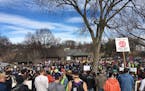 Protesters gather Saturday at Powderhorn Park in Minneapolis to show support for immigrants and refugees.