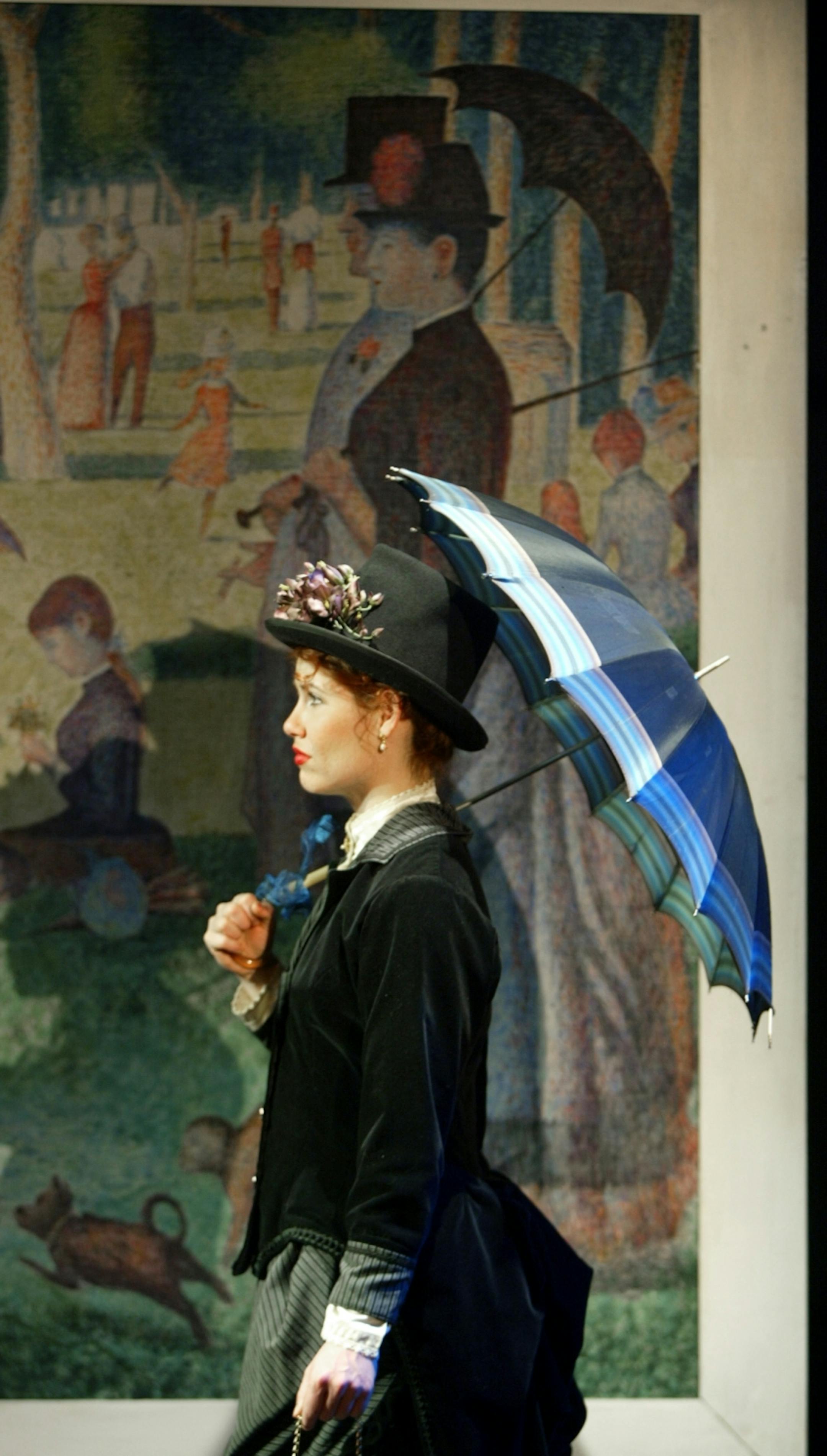 Ann Michels stars as Dot, costumed and made up to resemble one of the figures in "Grand Jatte." GENERAL INFORMATION: Minneapolis, Mn., Sat., Feb. 8, 2003 -- "Sunday in the Park with George," a musical by Stephen Sondheim, is presented by the Theatre Latte Da. The play is built around artist Georges Seurat and his painting "A Sunday Afternoon on the Island of Grand Jatte."