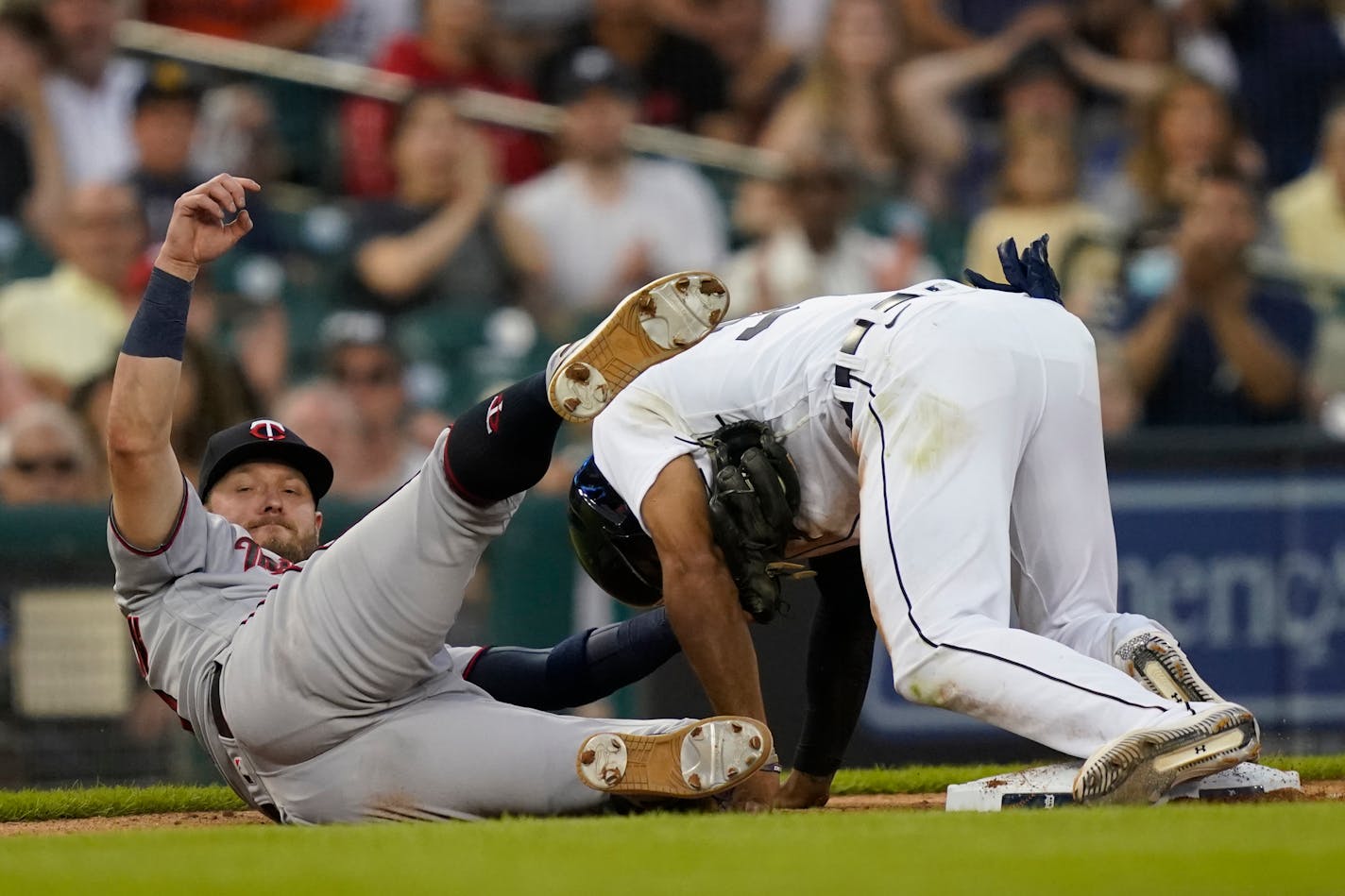 Detroit's Derek Hill beats the tag of Twins third baseman Josh Donaldson and steals third during the eighth inning