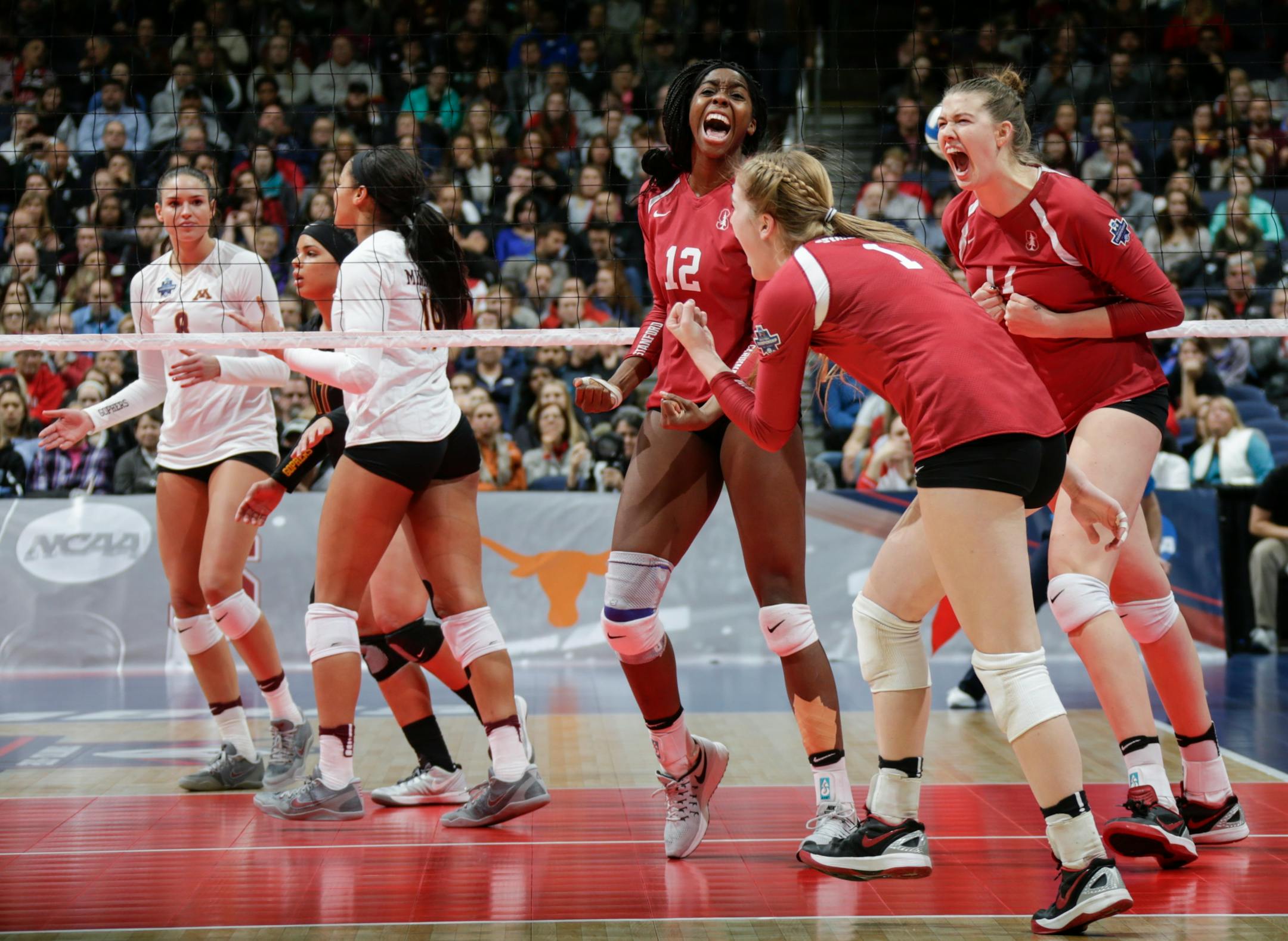Stanford's Inky Ajanaku (12), Jenna Gray (1) and Halland McKenna (14) react after a point during the second set against Minnesota in an NCAA women's volleyball national semifinal at Nationwide Arena in Columbus, Ohio, on Thursday, Dec. 15, 2016. (Joshua A. Bickel/Columbus Dispatch/TNS)