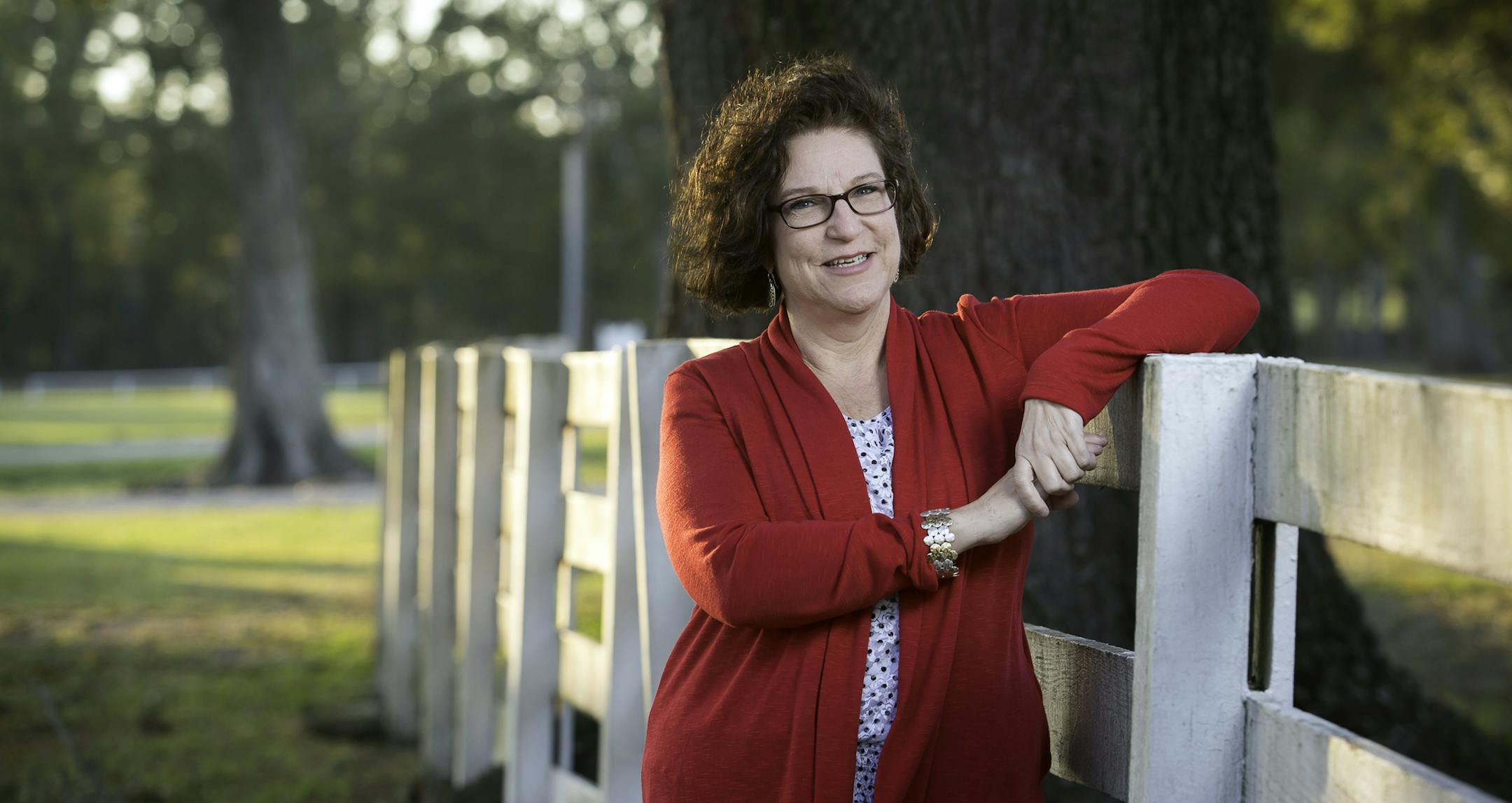 In this Nov. 12, 2013 photo, Diane LeBlanc, 50, poses for a photograph her office in Baton Rouge, La. LeBlanc lost 40 pounds since joining "Heads Up" , a supervised weight loss assistance program, provided by the Pennington Biomedical Research Center and the Louisiana Office of Group Benefits. (AP Photo/Tim Mueller)
