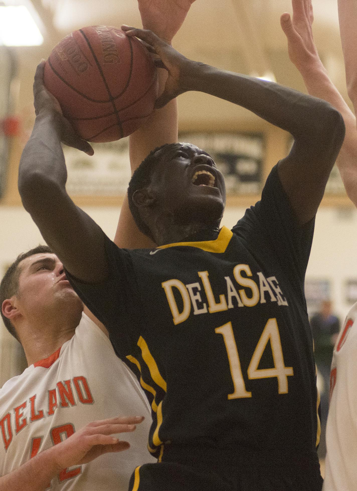 DeLaSalle's Goanar Mar fights up to the hoop during the first half of the Boys' Class 3A Section 6 State Basketball Final, March 3, 2016, at Chanhassen High School in Chanhassen, Minn. DeLaSalle won 71-51. (Matthew Hintz, 030316, Chanhassen) ORG XMIT: MIN1603032106010278