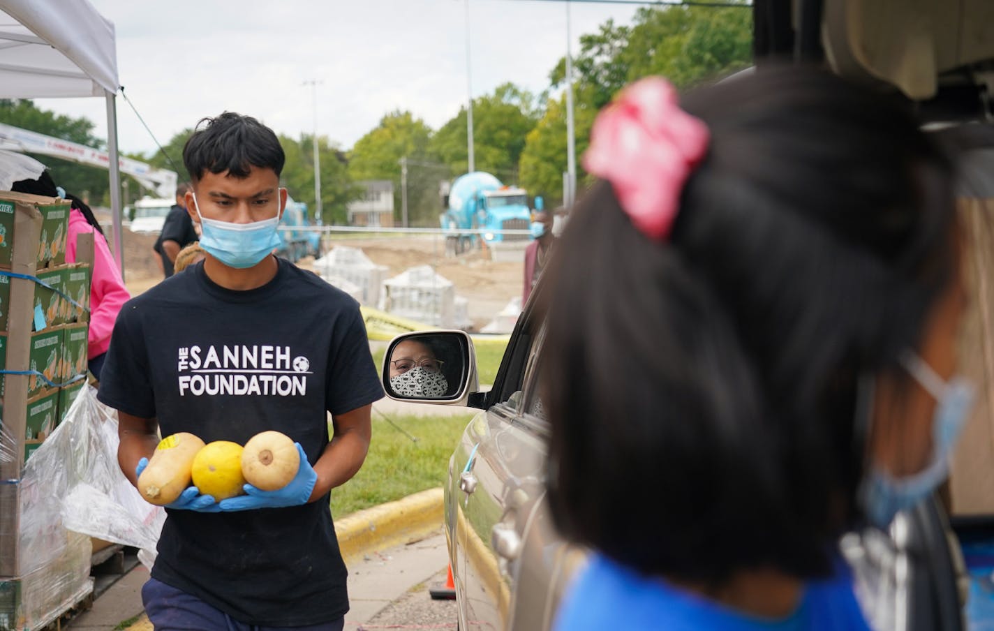 Volunteers handed out food at a drive-through event at The Sanneh Foundation in St. Paul. ] Shari L. Gross • shari.gross@startribune.com The Sanneh Foundation is building an $11 million seasonal dome and new athletic fields to promote year-round physical activity in St. Paul. The nonprofit has retooled during the pandemic to offer more free meals for families in need and a tutoring center for students to go to if they are in distance-only learning and can't stay home.