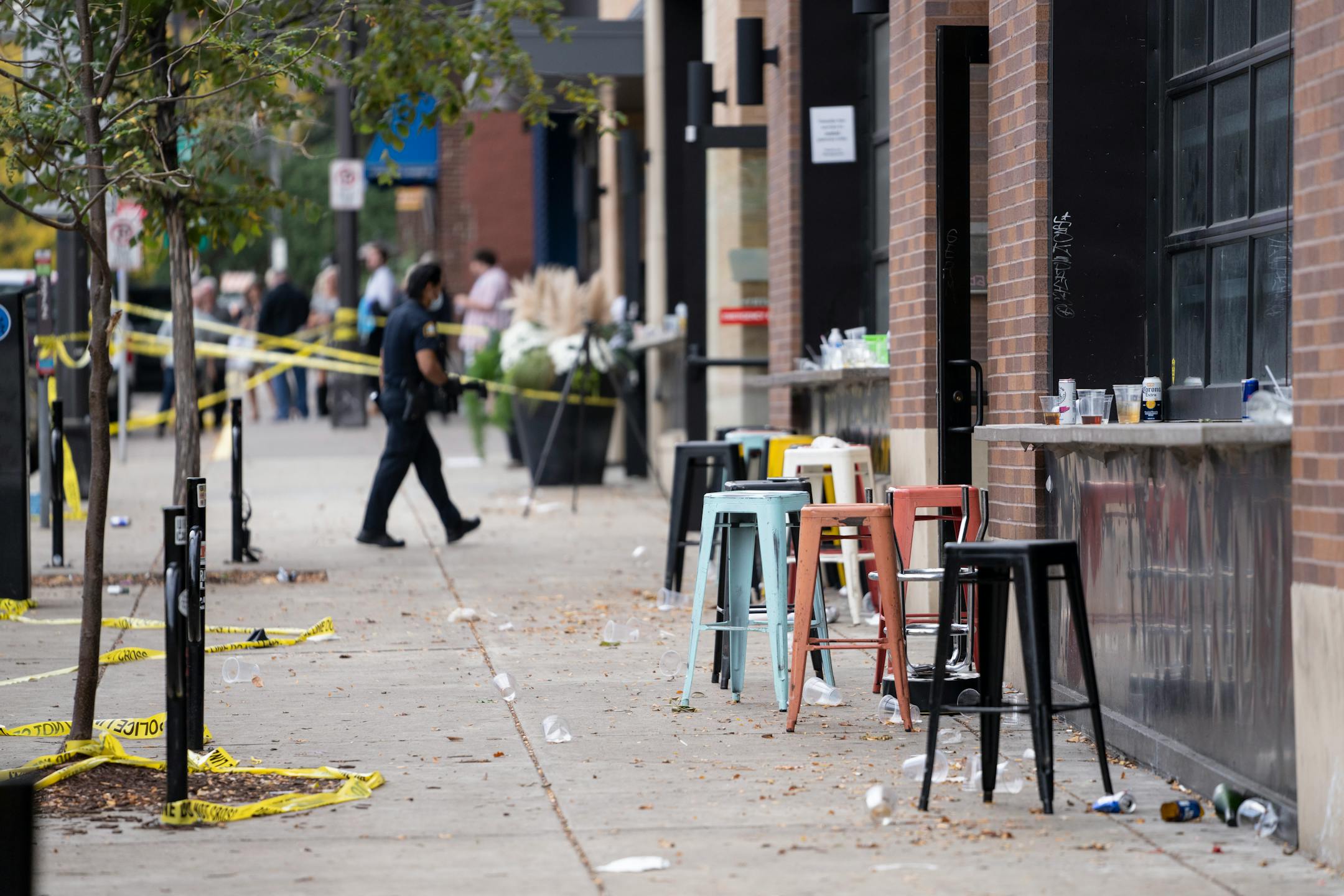 Investigators processed the chaotic scene of a multiple shooting at the bar Truck Park in St. Paul, Minn., that happened after midnight on Sunday, October 10, 2021.