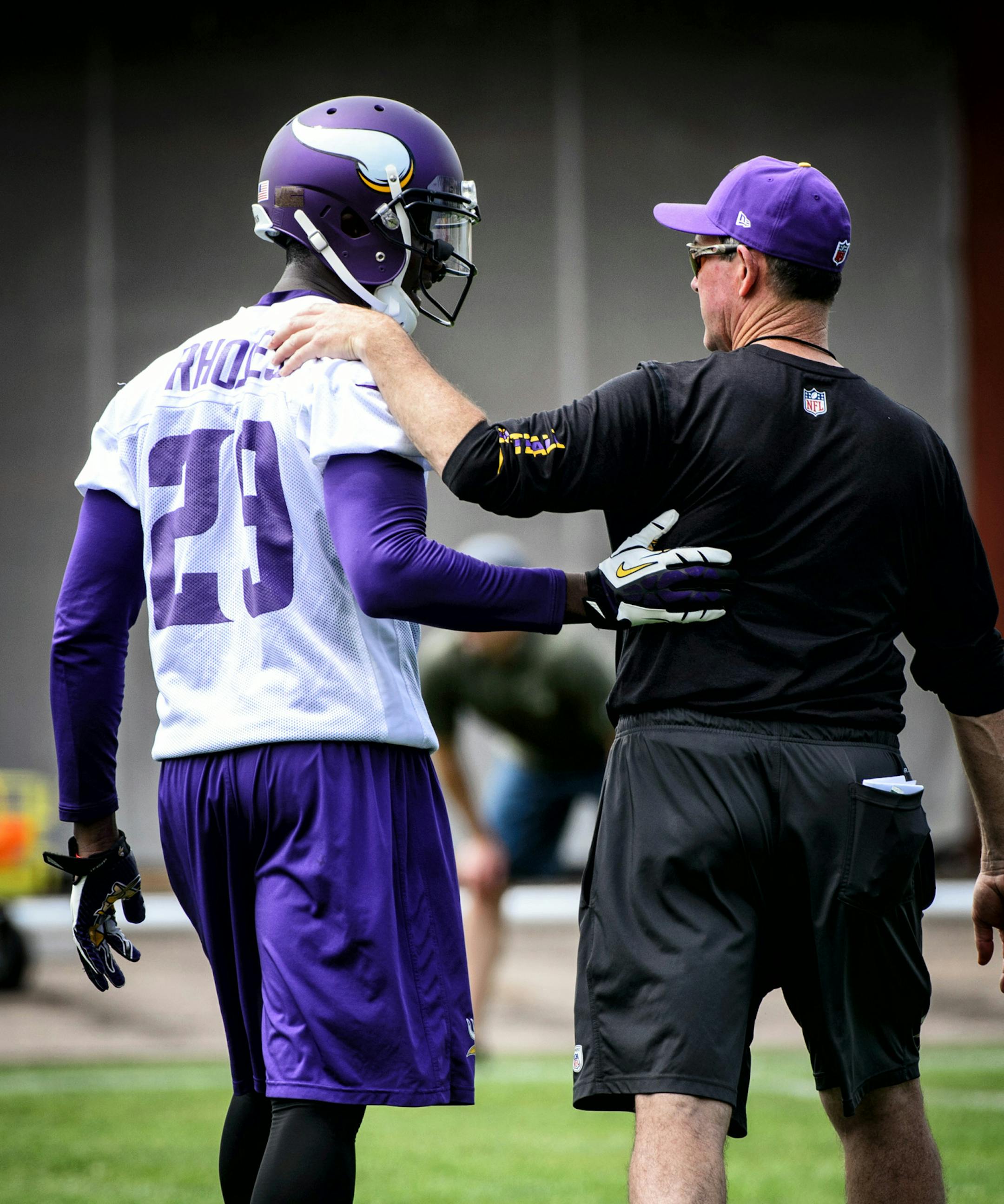 Head Coach Mike Zimmer talked with #29 Xavier Rhodes. Vikings mini-camp in Winter Park. ] GLEN STUBBE * gstubbe@startribune.com Tuesday June 17, 2014