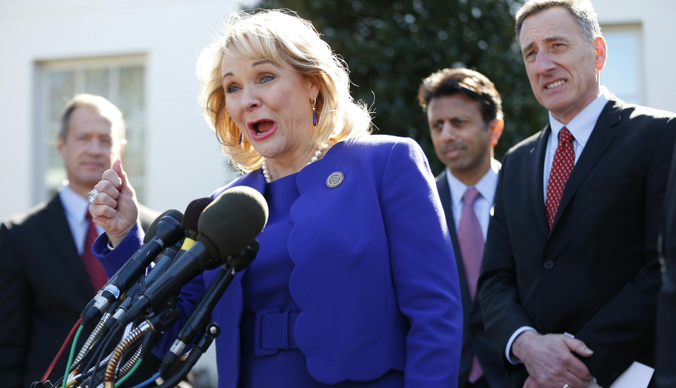National Governors Association (NGA) Chair Oklahoma Gov. Mary Fallin, center, speaks to reporters outside the White House in Washington, Monday, Feb. 24, 2014, following a meeting between President Barack Obama and members of the NGA. From left are, Maryland Gov. Martin O'Malley, Fallin, Louisiana Gov. Bobby Jindal, and Vermont Gov. Peter Shumlin. (AP Photo/Charles Dharapak)