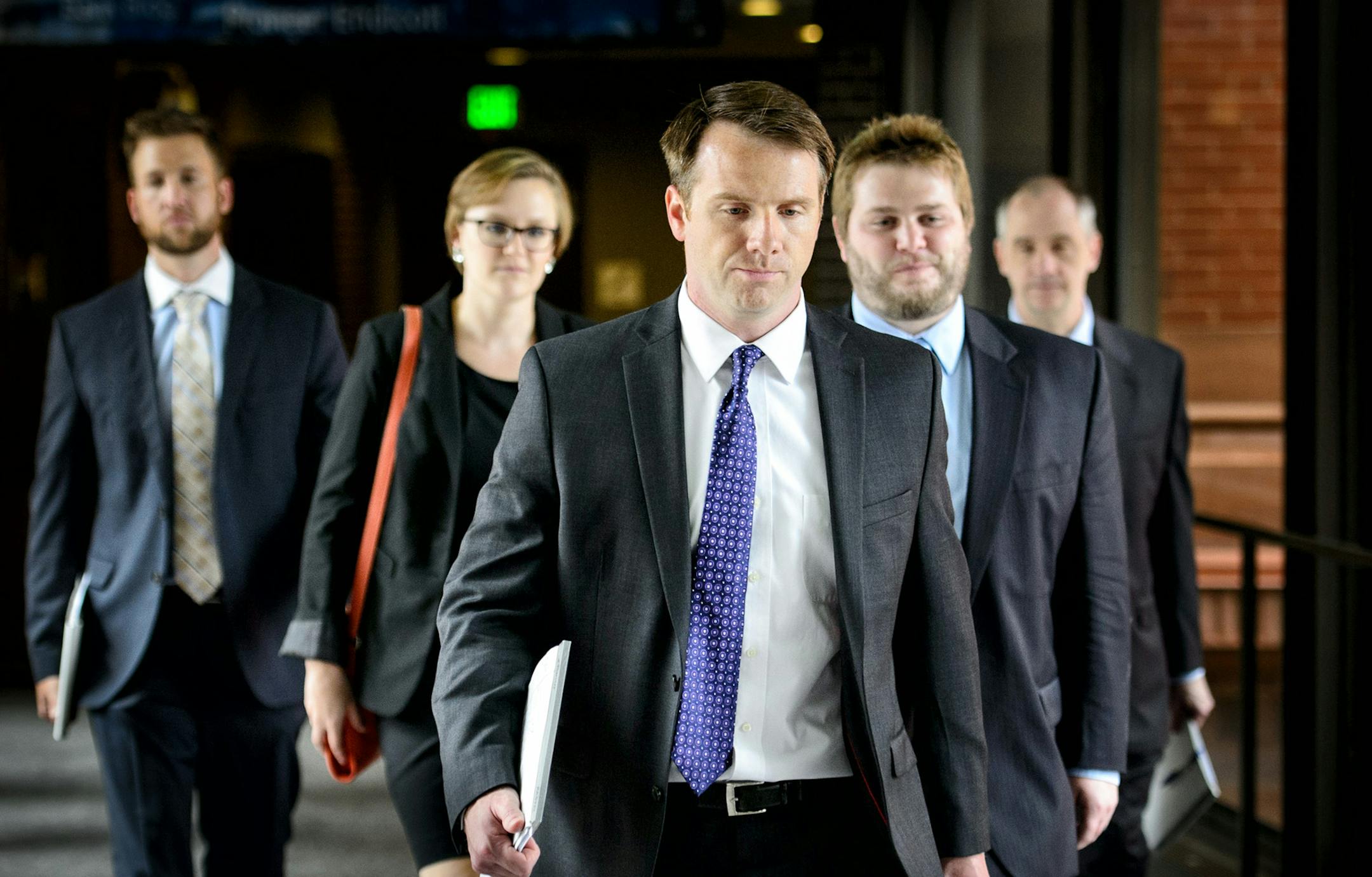 Jesse Ventura's legal team entered the St. Paul Federal Courthouse Friday afternoon at 2:38 and left 14 minutes later at 2:52 after the jury was sent home after four days of deliberation without a verdict. Friday, July 25, 2014. ] GLEN STUBBE * gstubbe@startribune.com EDS: here jury is entering