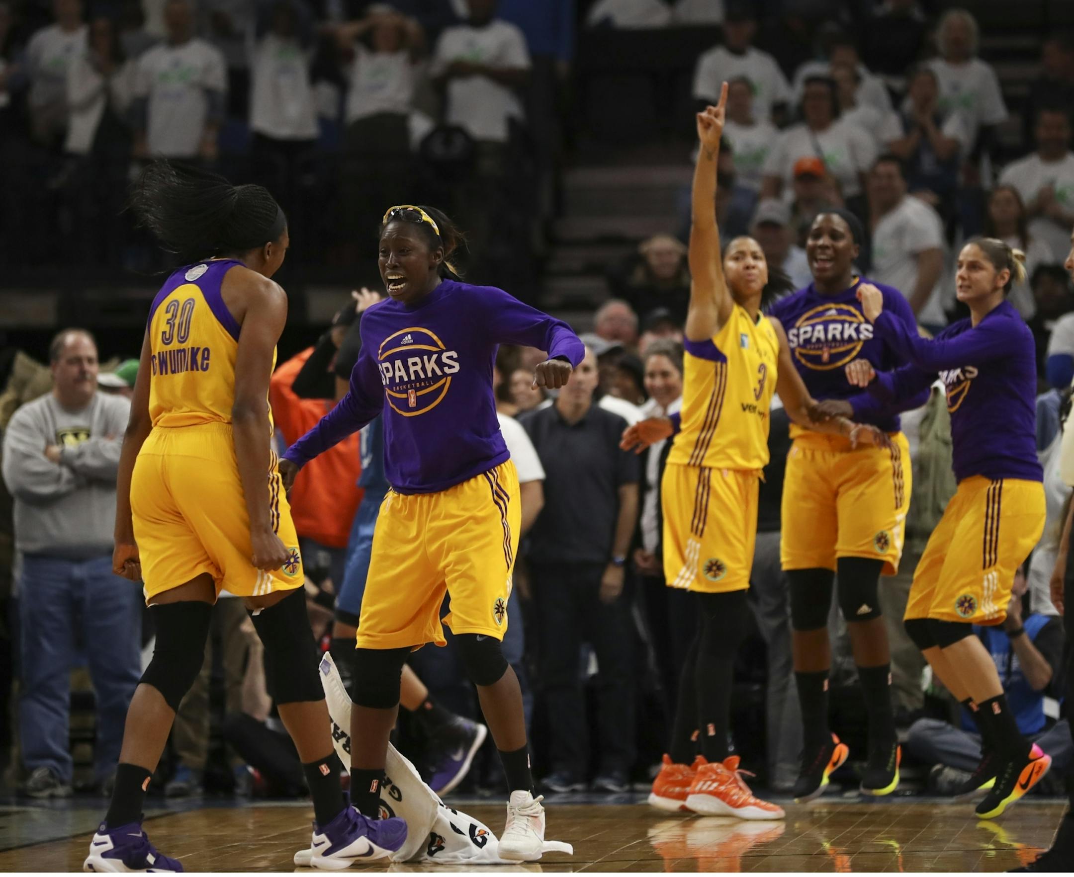 Los Angeles Sparks forward Essence Carson (17) rushed onto the court to celebrate with Los Angeles Sparks forward Nneka Ogwumike (30).