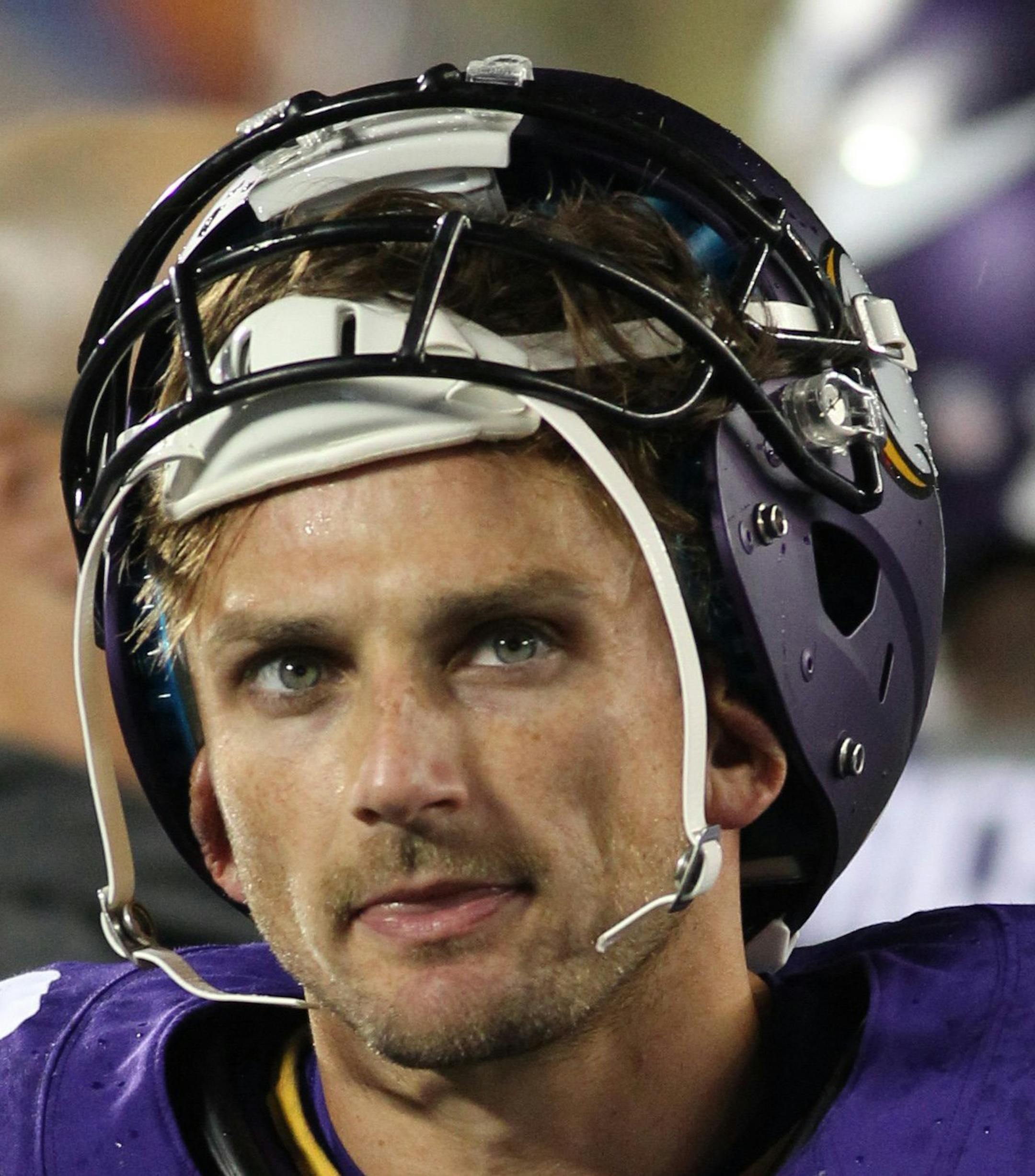 FILE - In this Aug. 22, 2015, file photo, Minnesota Vikings kicker Blair Walsh stands in the bench area during the second half of a preseason NFL football game against the Oakland Raiders in Minneapolis. The Vikings gave Blair Walsh a contract extension in the offseason, locking up their Pro Bowl kicker for the long term. But he's been shaky in the preseason, including three missed field goals and a shanked extra point against Oakland. (AP Photo/Andy King, File) ORG XMIT: NY156