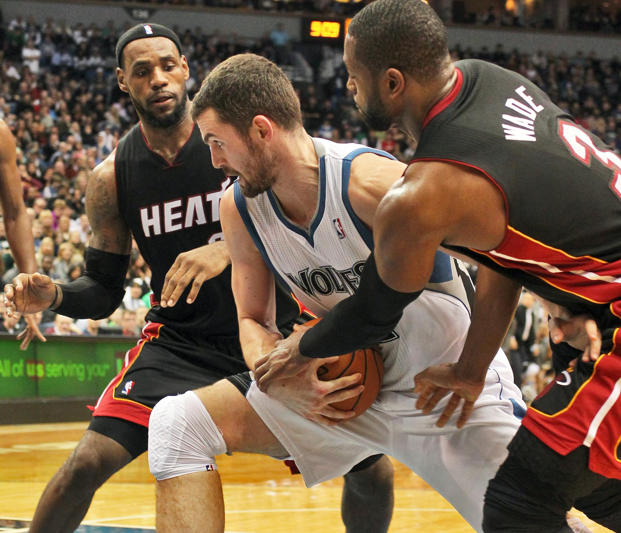 LeBron James, left and the Wolves' Kevin Love.