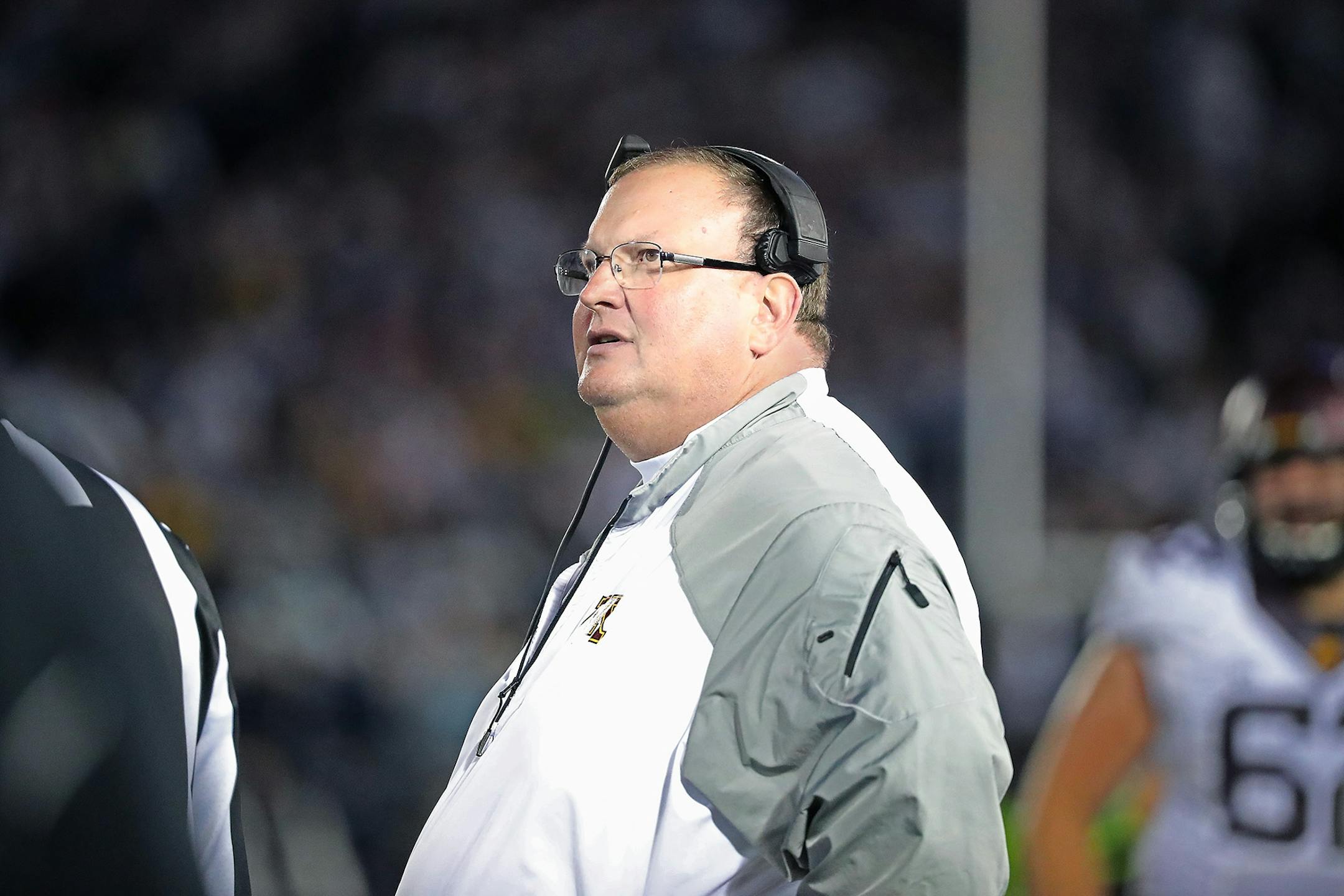 Minnesota's head coach Tracy Claeys looked at the clock to call a time out in the fourth quarter as Minnesota took on Penn State at Beaver Stadium, Saturday, October 1, 2016 in State College, PA.