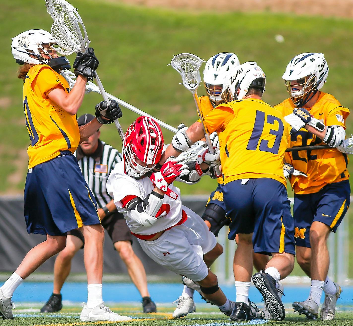 Matthew Dowden bulled his way through a pack of Mahtomedi defenders to score a second-half goal in Benilde-St. Margaret's 9-6 boys' lacrosse state tournament semifinal victory over the Zephyrs on Thursday, June 14, 2018, at Minnetonka High School. The Mahtomedi defenders included goalie Brodi Larson, left, Joe Urbanski, Peyton Sarnek (13) and Sam Donna (22). Photo by Mark Hvidsten, SportsEngine