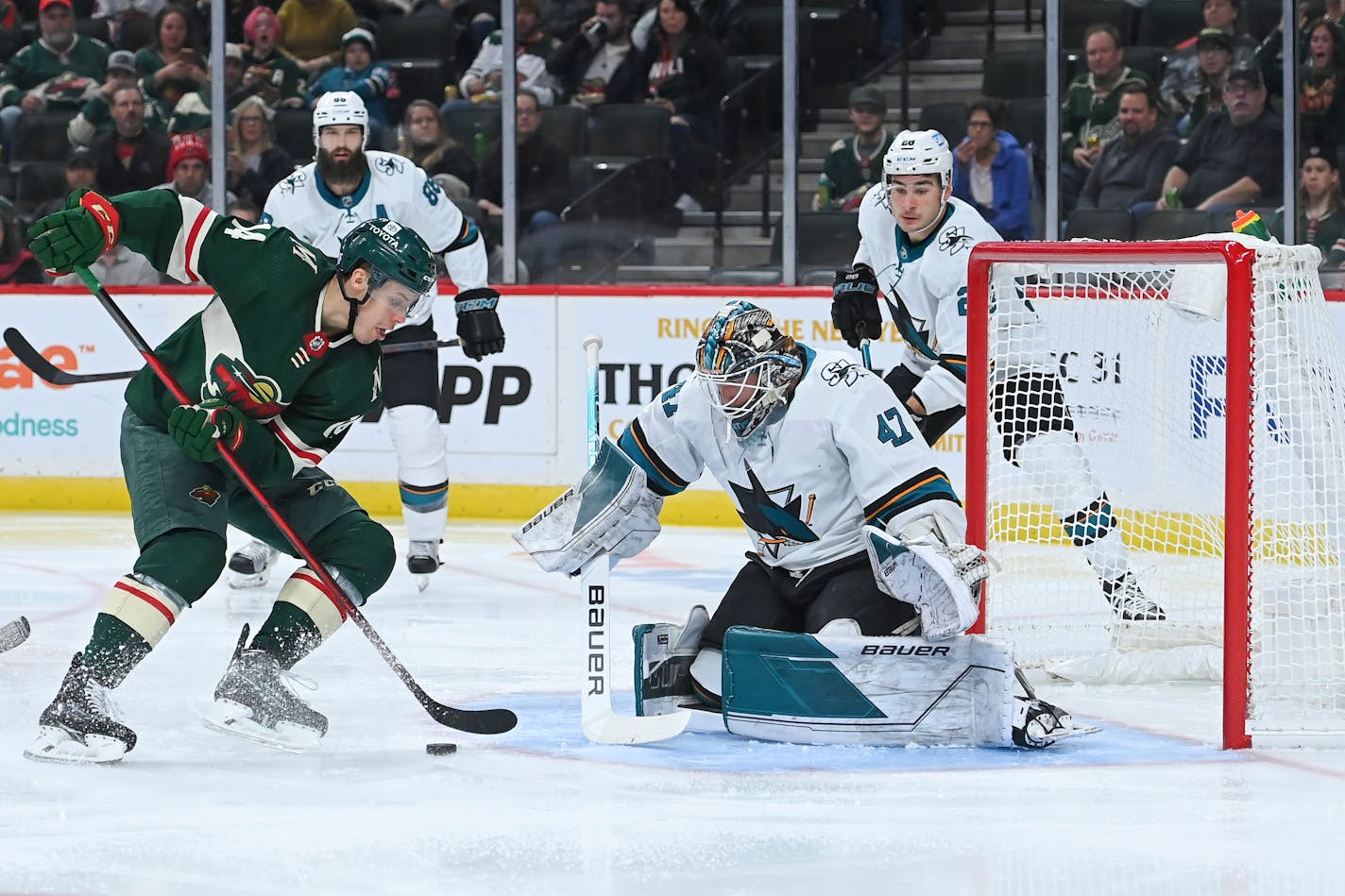 Wild center Joel Eriksson Ek positions himself for a shot but was unable to score against San Jose goaltender James Reimer.