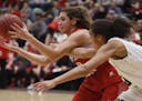 Ke James(50) looks to post up against Mykel Parham(40) of Apple Valley.]Lakeville North takes on Apple Valley in girl's basketball at Lakeville North'