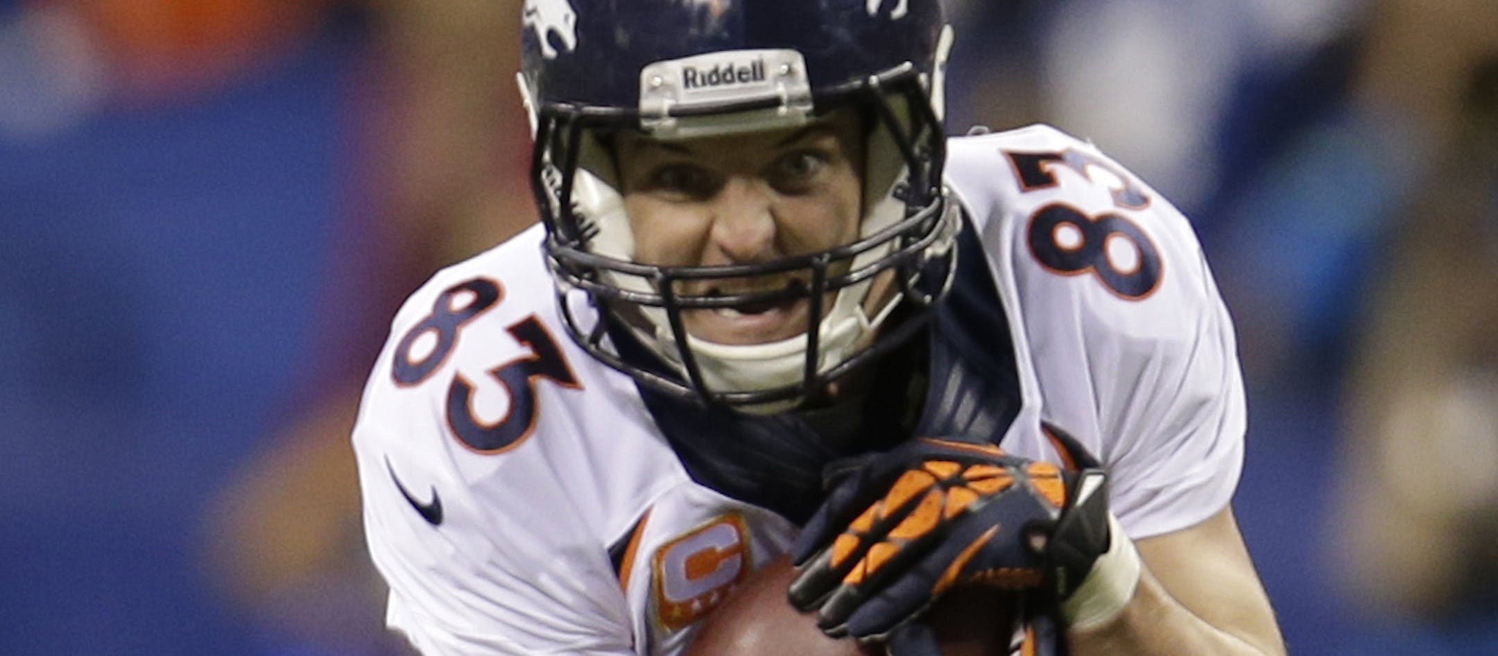 Denver Broncos wide receiver Wes Welker (83) gets tackles by Indianapolis Colts free safety Darius Butler (20) during the second half of an NFL football game, Sunday, Oct. 20, 2013, in Indianapolis. (AP Photo/AJ Mast)