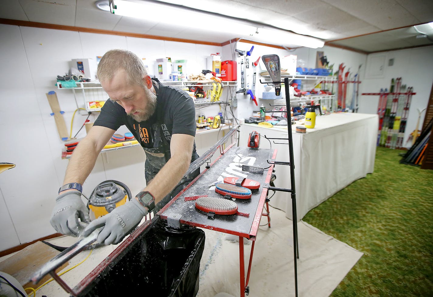 Bjorn Hanson worked on a pair of skis at Out There Nordic Sports ski shop, Thursday, February 4, 2016 in Rice Lake, Wis. Bjorn and his wife Kristin Hanson the small ski shop that supports and sponsors several Olympic athletes. ] (ELIZABETH FLORES/STAR TRIBUNE) ELIZABETH FLORES &#x2022; eflores@startribune.com