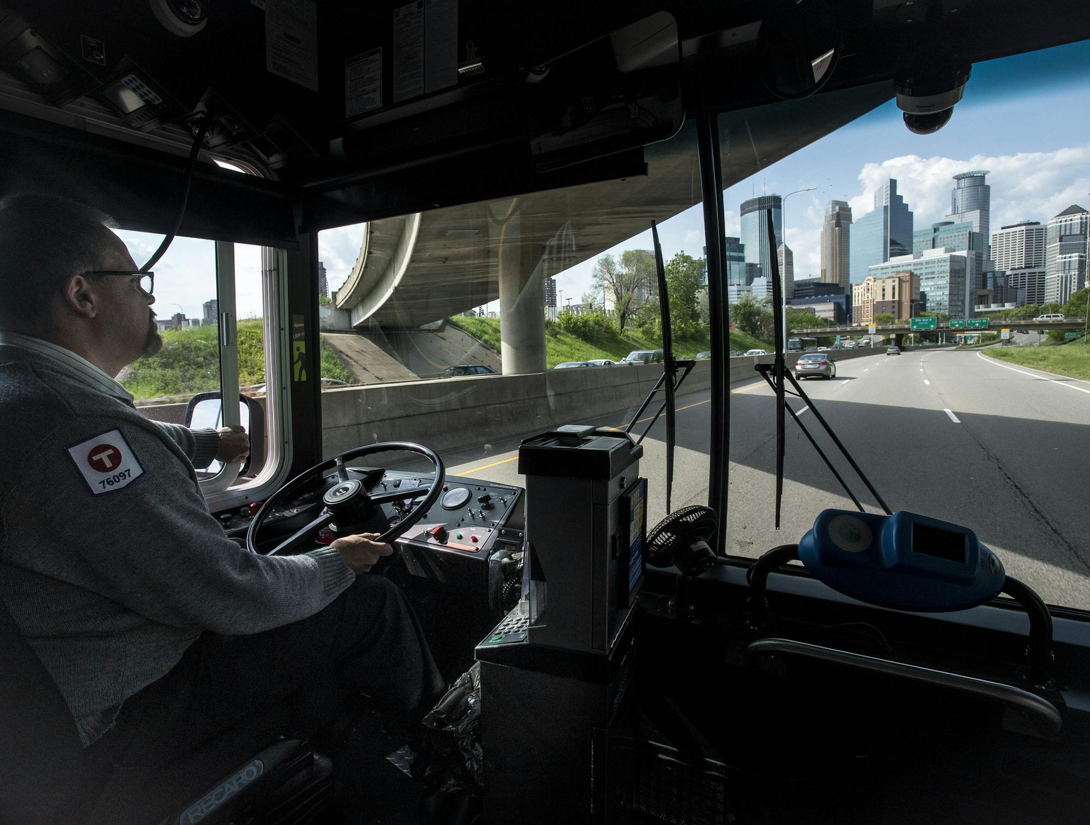 New Metro Transit bus driver James Hitz drove his bus toward downtown Minneapolis on his way to pick up passengers on his route Thursday. ] (AARON LAVINSKY/STAR TRIBUNE) aaron.lavinsky@startribune.com We photograph new Metro Transit bus driver James Hitz, of Apple Valley, as he picked up and dropped off commuters along route 17F in Minneapolis on Thursday, May 19, 2016. "It's the best decision I've ever made," said Hitz of his decision to change career fields from office work to driving a bus. F