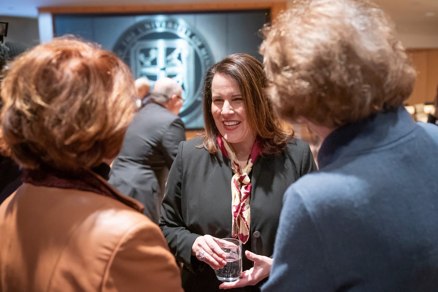 Joan Gabel mingled in the room just before the Board of Regents voted unanimously to hire her as the university's first female president.