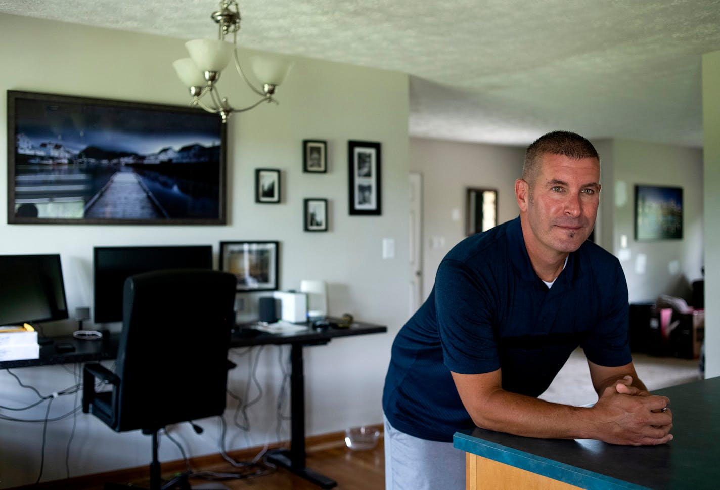 Todd Eckstein, 47, inside his home in Cincinnati on Aug. 4. Eckstein recently contracted the coronavirus after a trip with friends to Provincetown, Mass., for the July Fourth weekend, even though he is fully vaccinated. MUST CREDIT: Photo by Ty Wright for The Washington Post.