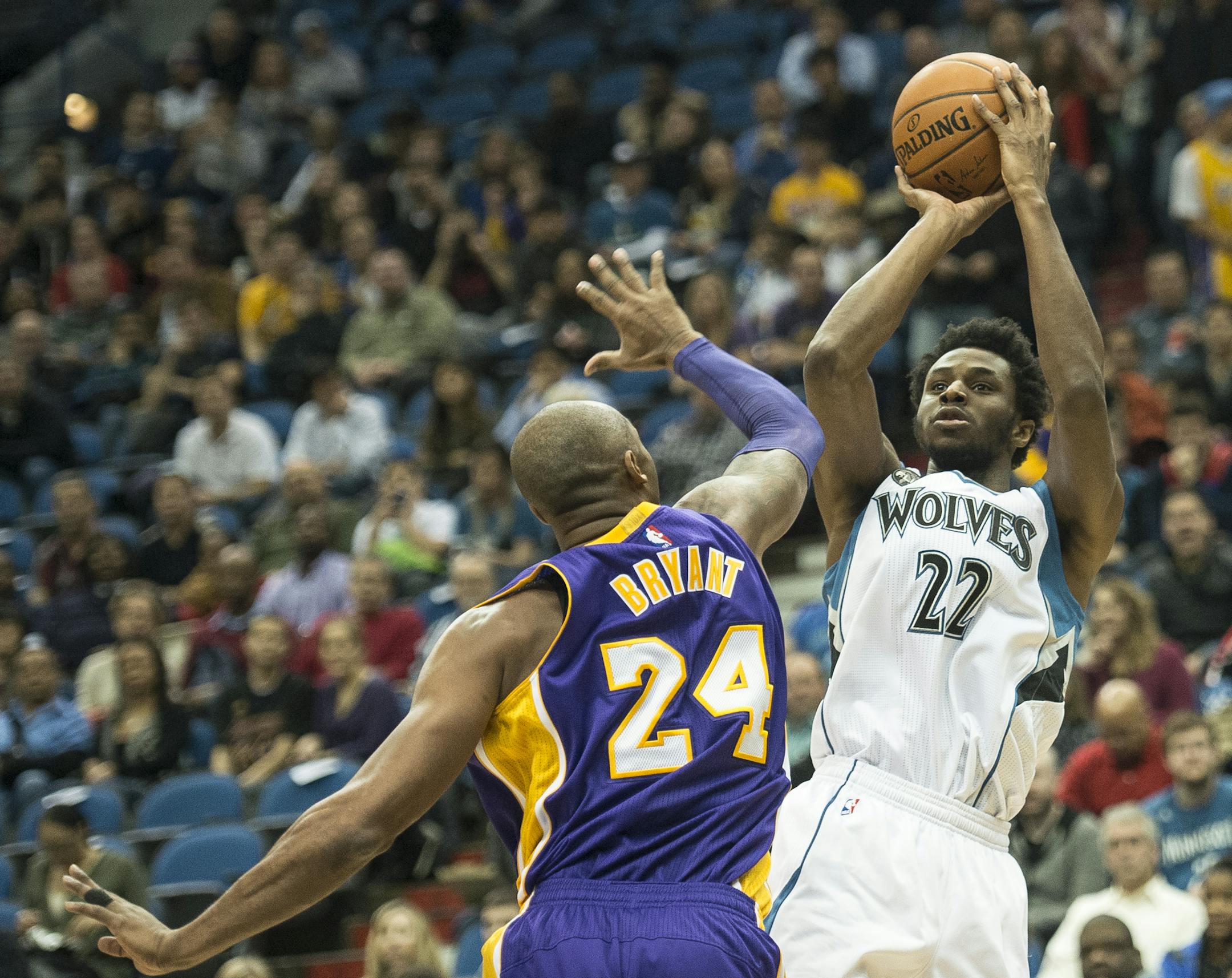 Minnesota Timberwolves guard Andrew Wiggins (22) hit a 2-point shot over Los Angeles Lakers forward Kobe Bryant (24) in the first quarter. ] (AARON LAVINSKY/STAR TRIBUNE) aaron.lavinsky@startribune.com The Minnesota Timberwolves played the Los Angeles Lakers on Wednesday, Dec. 9, 2015 at Target Center in Minneapolis, Minn.