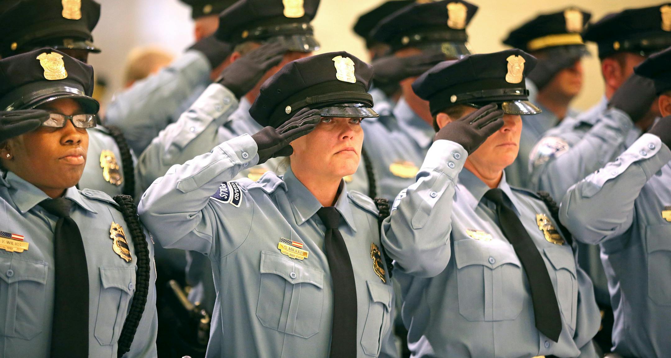 Members of the Minneapolis Police Department and the Hennepin County Sheriffís office stood during the playing the anthem at City Hall Tuesday May 12, 2015 in Minneapolis, MN. In honor of National Police Week, Minneapolis Police Department and Hennepin County Sheriffs Office Law Enforcement will hold Memorial Ceremony.] Jerry Holt/ Jerry.Holt@Startribune.com