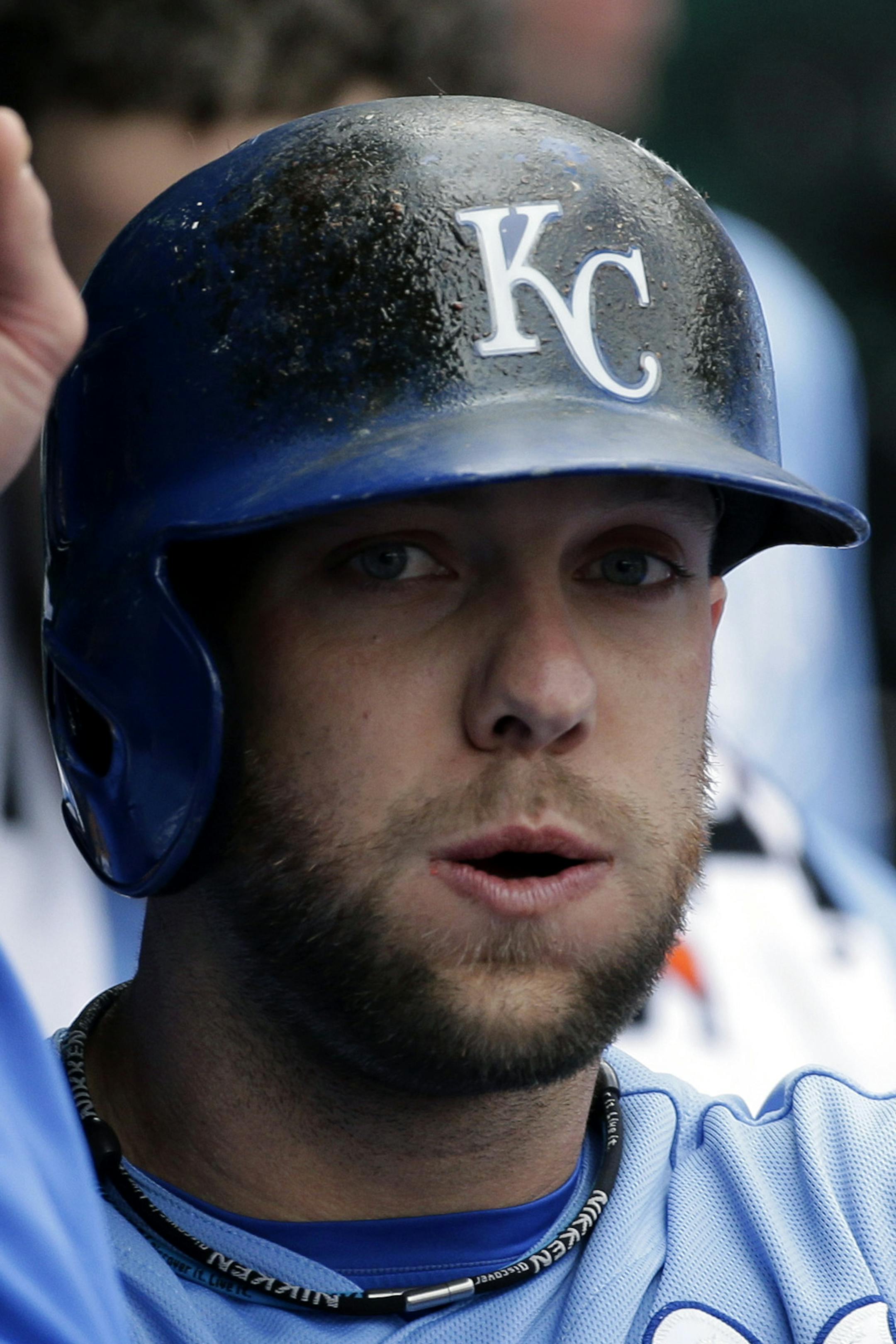 Kansas City Royals' Alex Gordon celebrates in the dugout with teammates after scoring on a double by Billy Butler during the first inning of a baseball game against the Chicago White Sox Monday, May 6, 2013, in Kansas City, Mo. (AP Photo/Charlie Riedel)