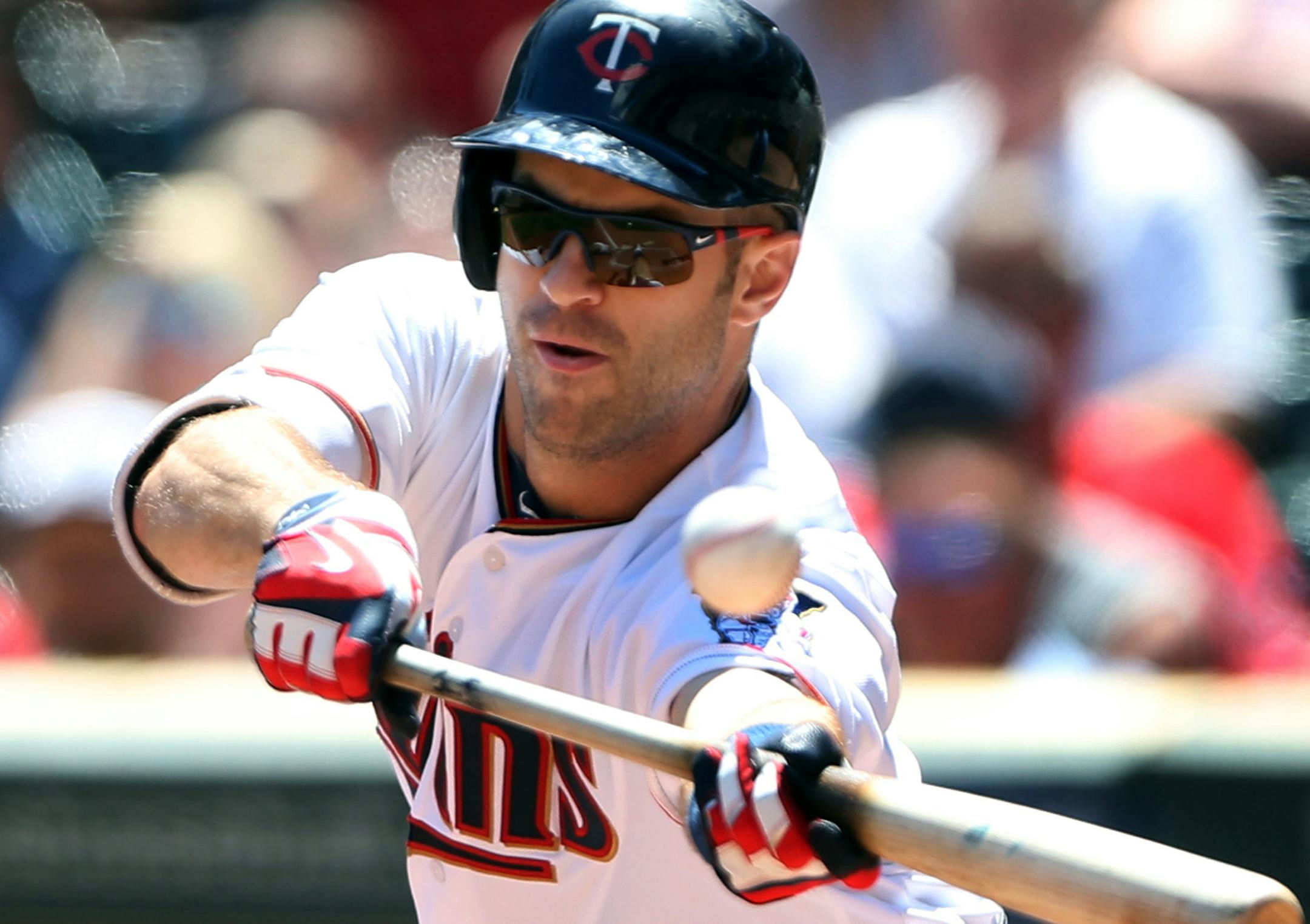 Minnesota Twins first baseman Joe Mauer (7) misses on a bunt attempt during the third inning on Sunday, July 3, 2016, at Target Field in Minneapolis. (Jerry Holt/Minneapolis Star Tribune/TNS) ORG XMIT: 1186849