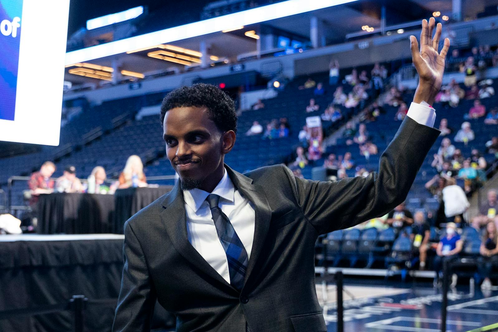 Mayoral candidate Omar Fateh waves to the crowd during the Minneapolis DFL's mayoral convention at Target Center on July 19. 