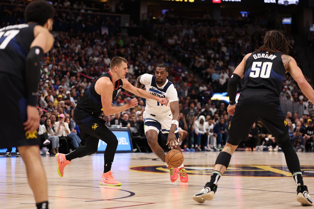 Naz Reid drives toward the basket in Game 2 against the Nuggets on Monday night as the Timberwolves continued their drive toward the NBA title.