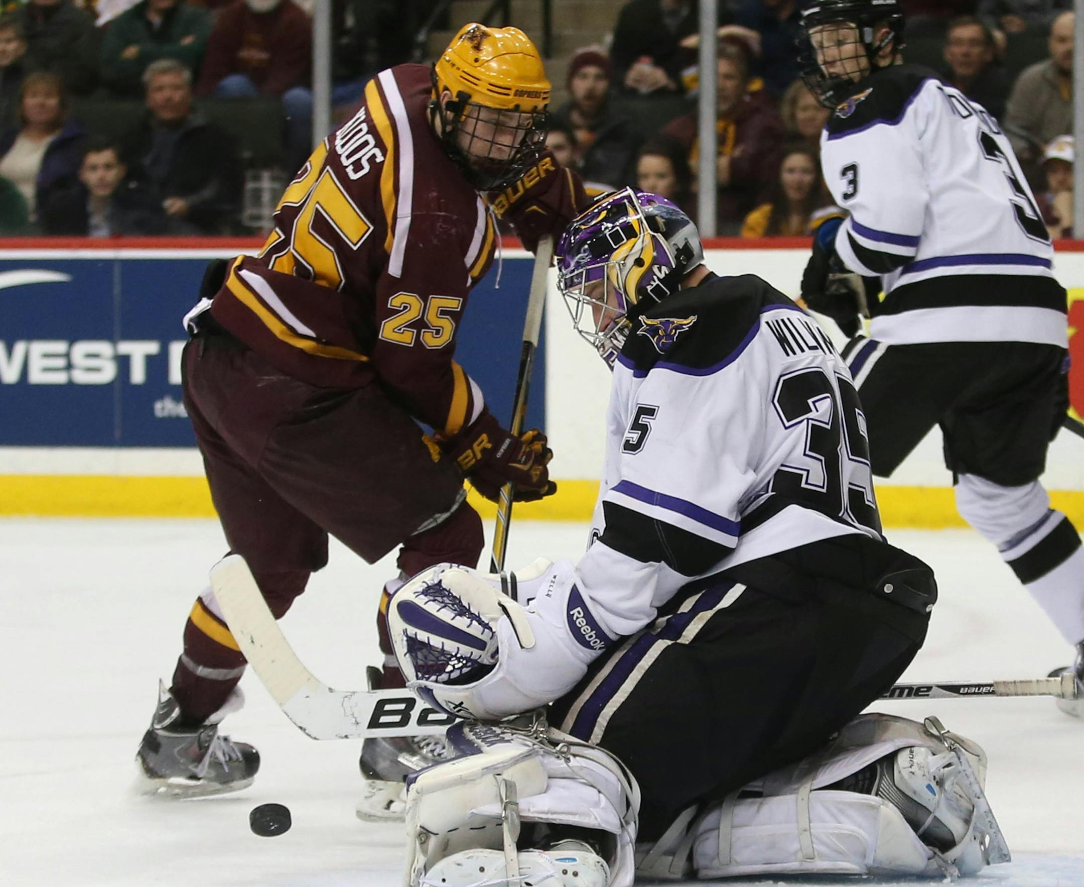 Minnesota State's Stephon Williams block the shot of Gopher Justin Kloos during the second period. ] (KYNDELL HARKNESS/STAR TRIBUNE) kyndell.harkness@startribune.com Gophers vs Minnesota State at the Xcel Energy Center in St. Paul Min., Friday, January 23, 2015.